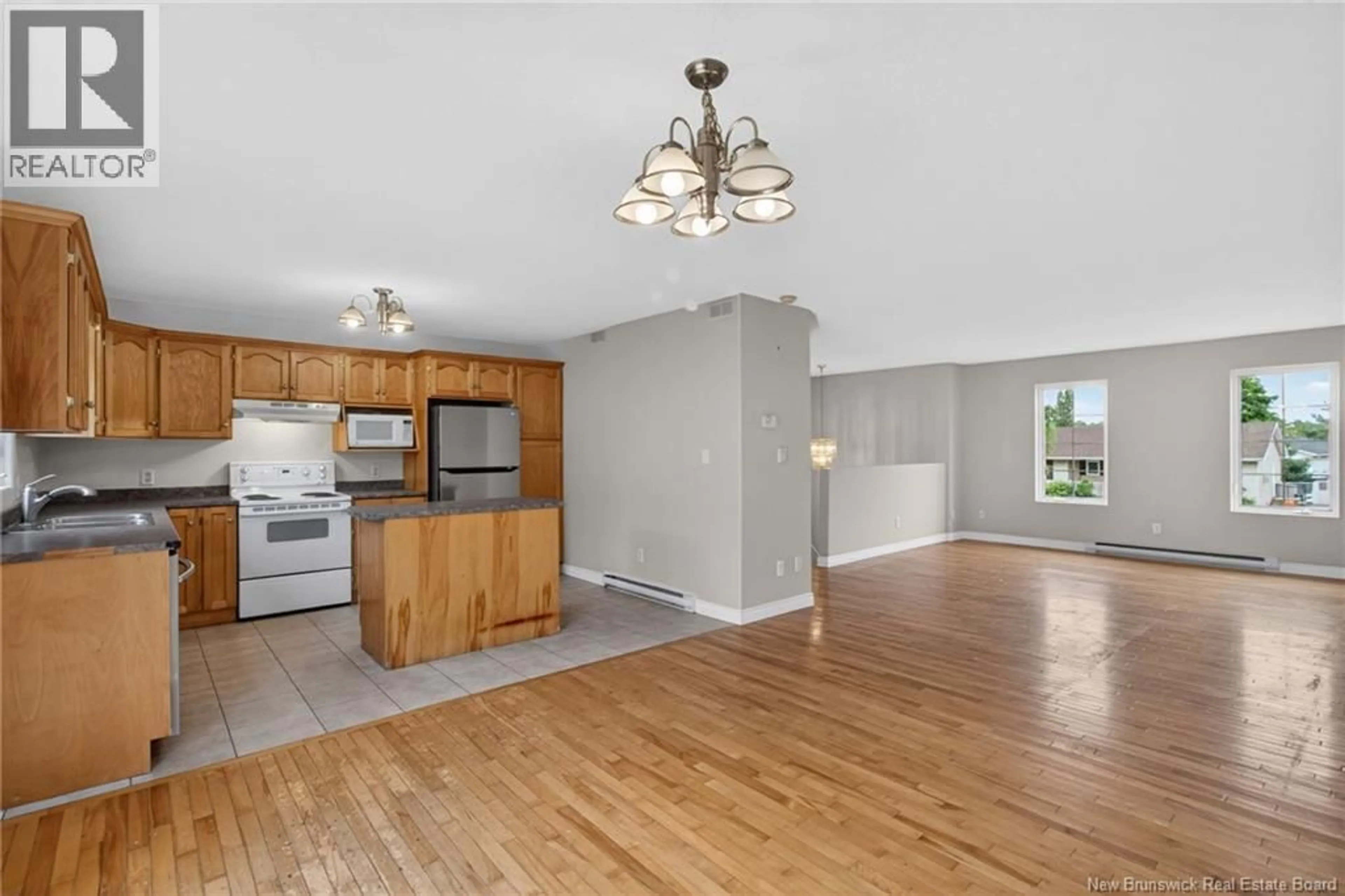 Open concept kitchen, wood/laminate floor for 75-77 HEMMER JANE, Moncton New Brunswick E1G2H4
