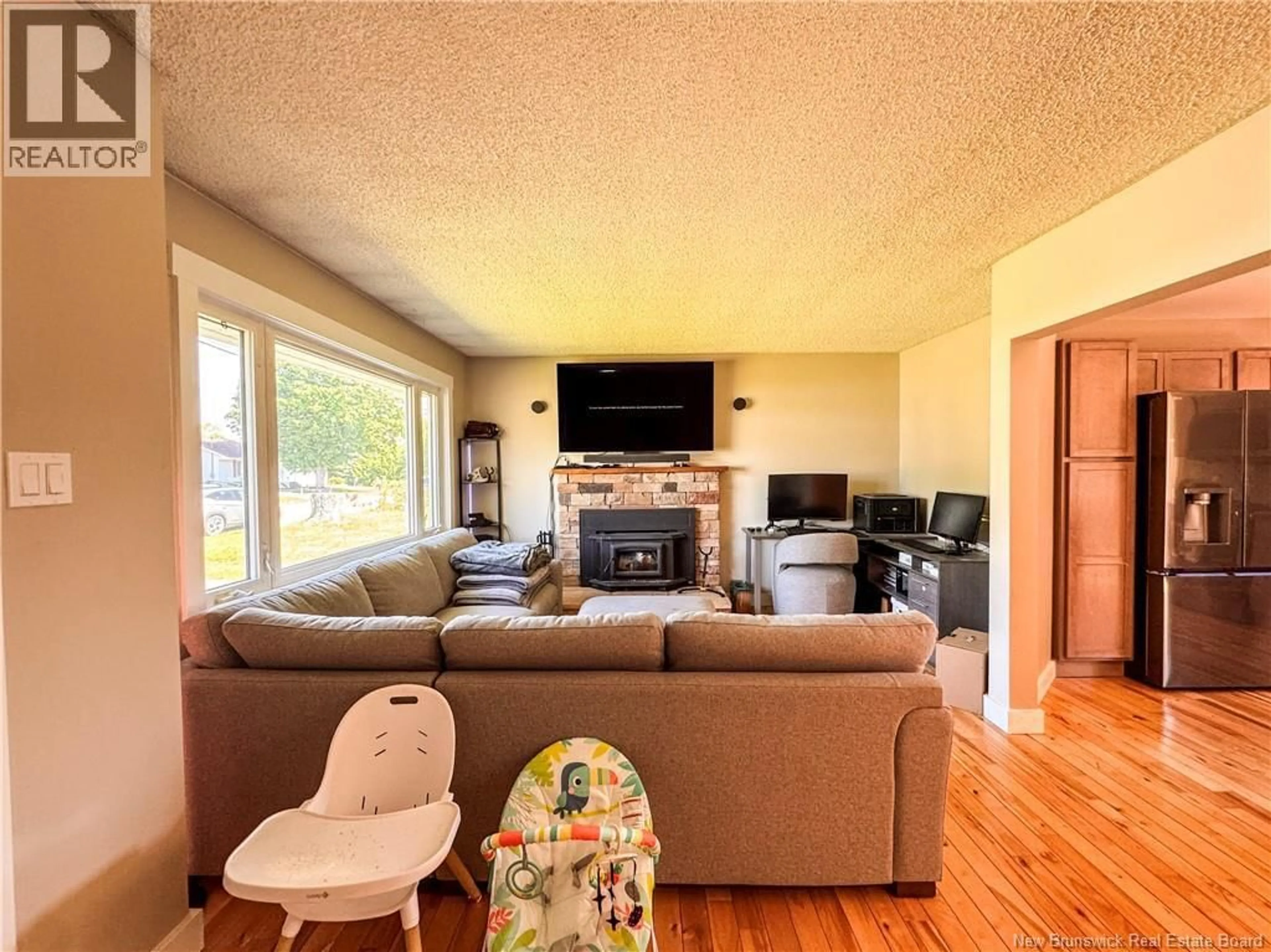 Living room with furniture, wood/laminate floor for 16 BICKERTON AVENUE, Sackville New Brunswick E4L3M7