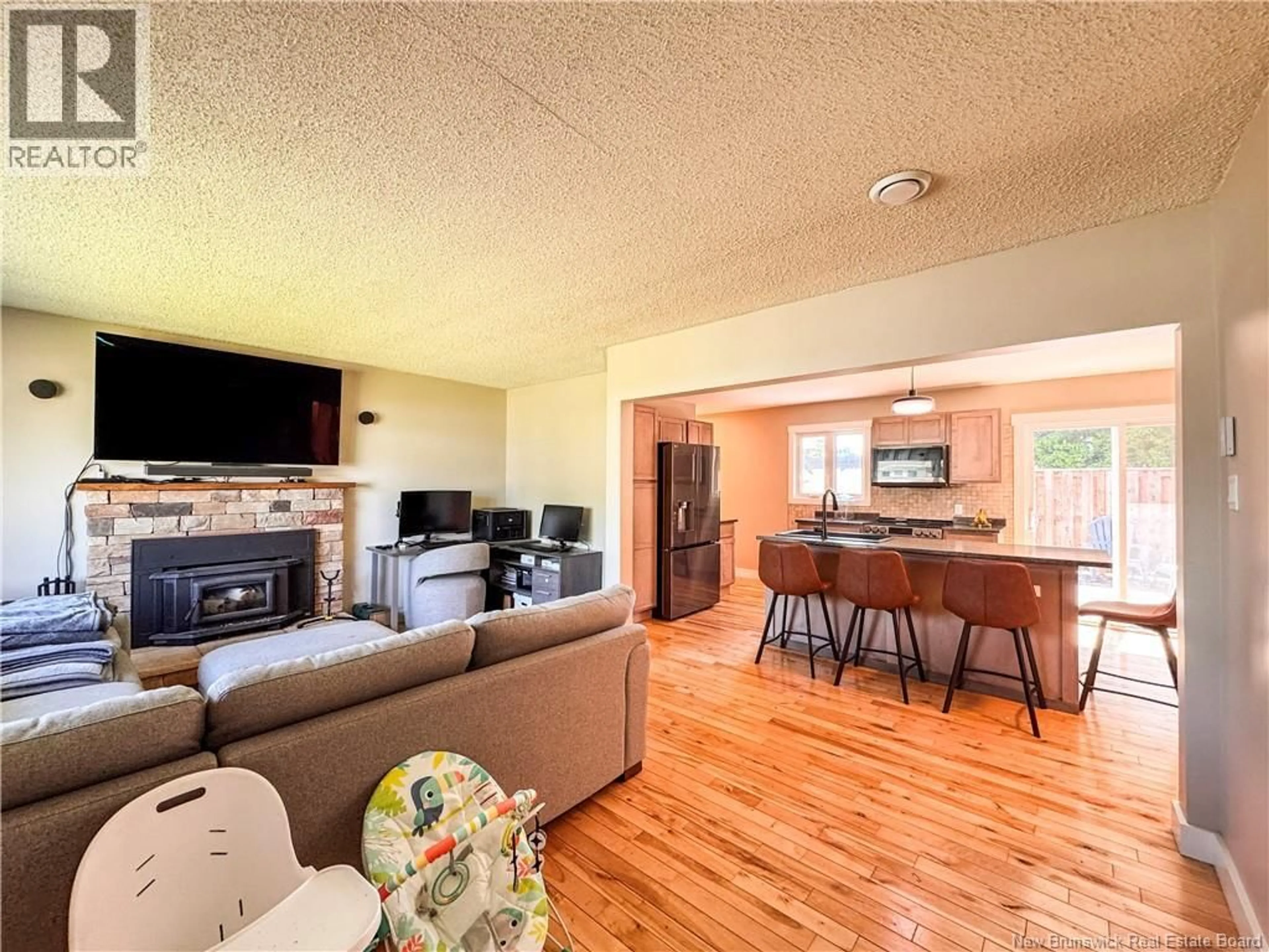 Living room with furniture, wood/laminate floor for 16 BICKERTON AVENUE, Sackville New Brunswick E4L3M7