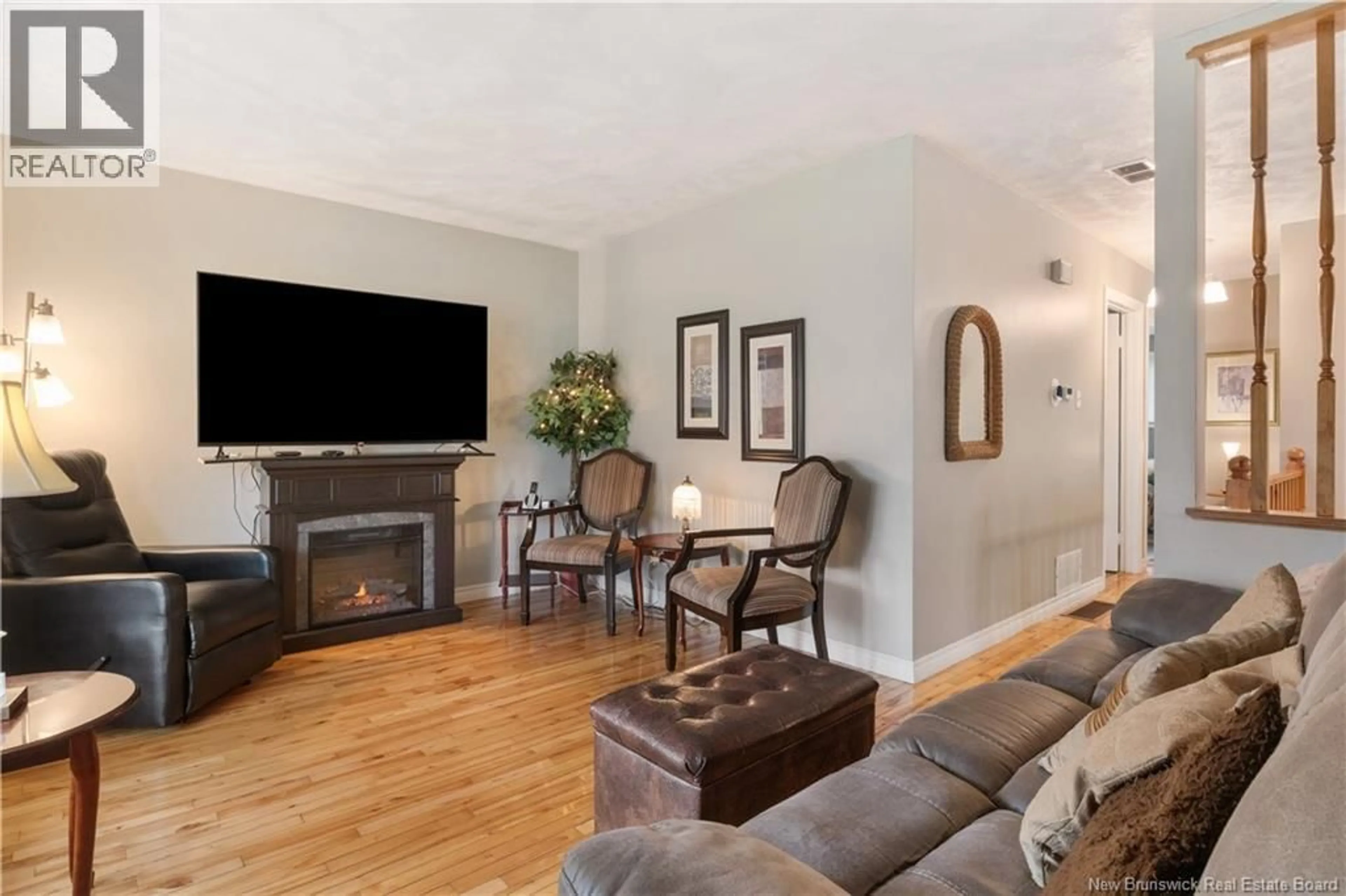Living room with furniture, wood/laminate floor for 199 CEDAR, Moncton New Brunswick E1C7L6