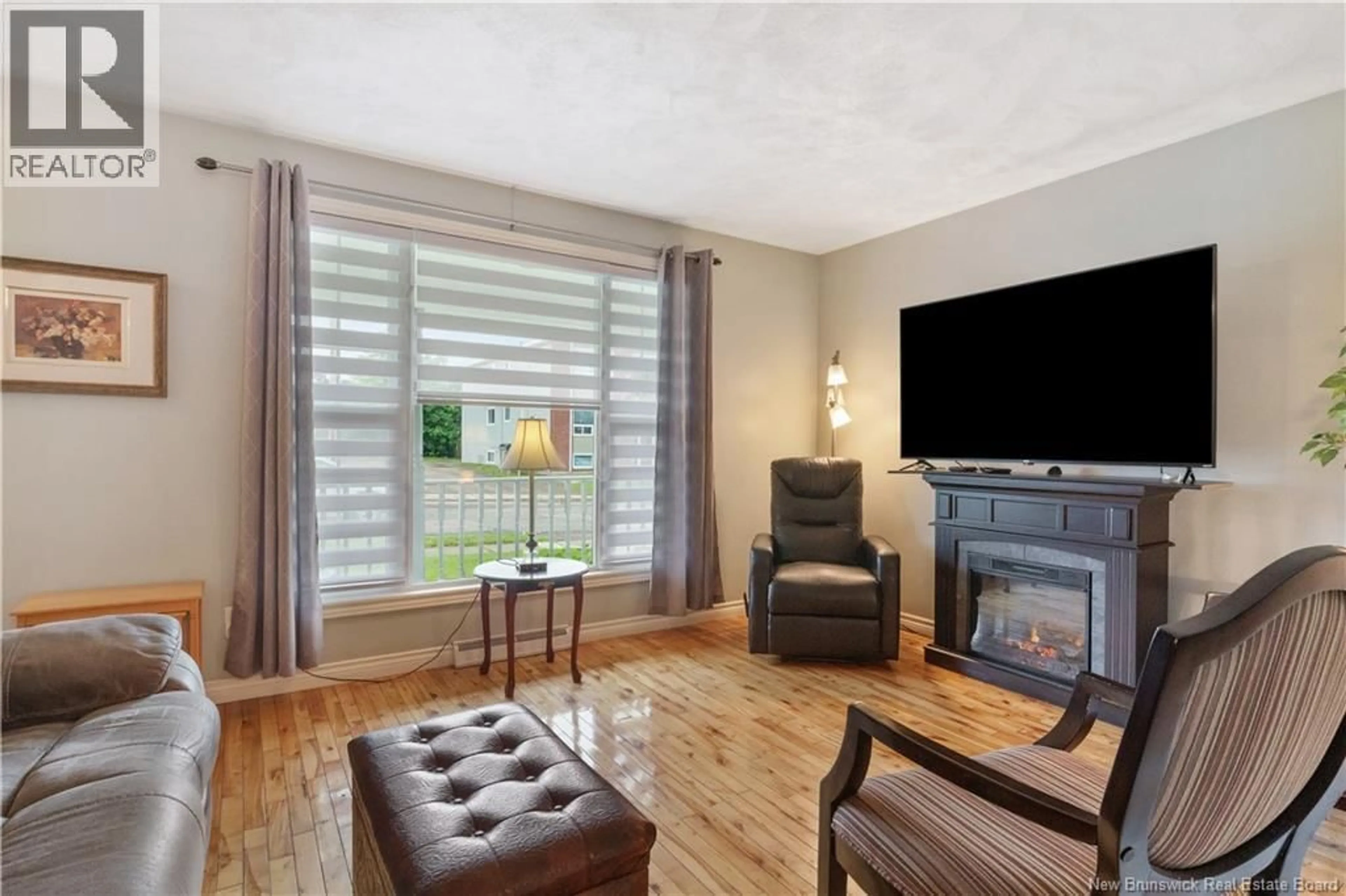 Living room with furniture, wood/laminate floor for 199 CEDAR, Moncton New Brunswick E1C7L6