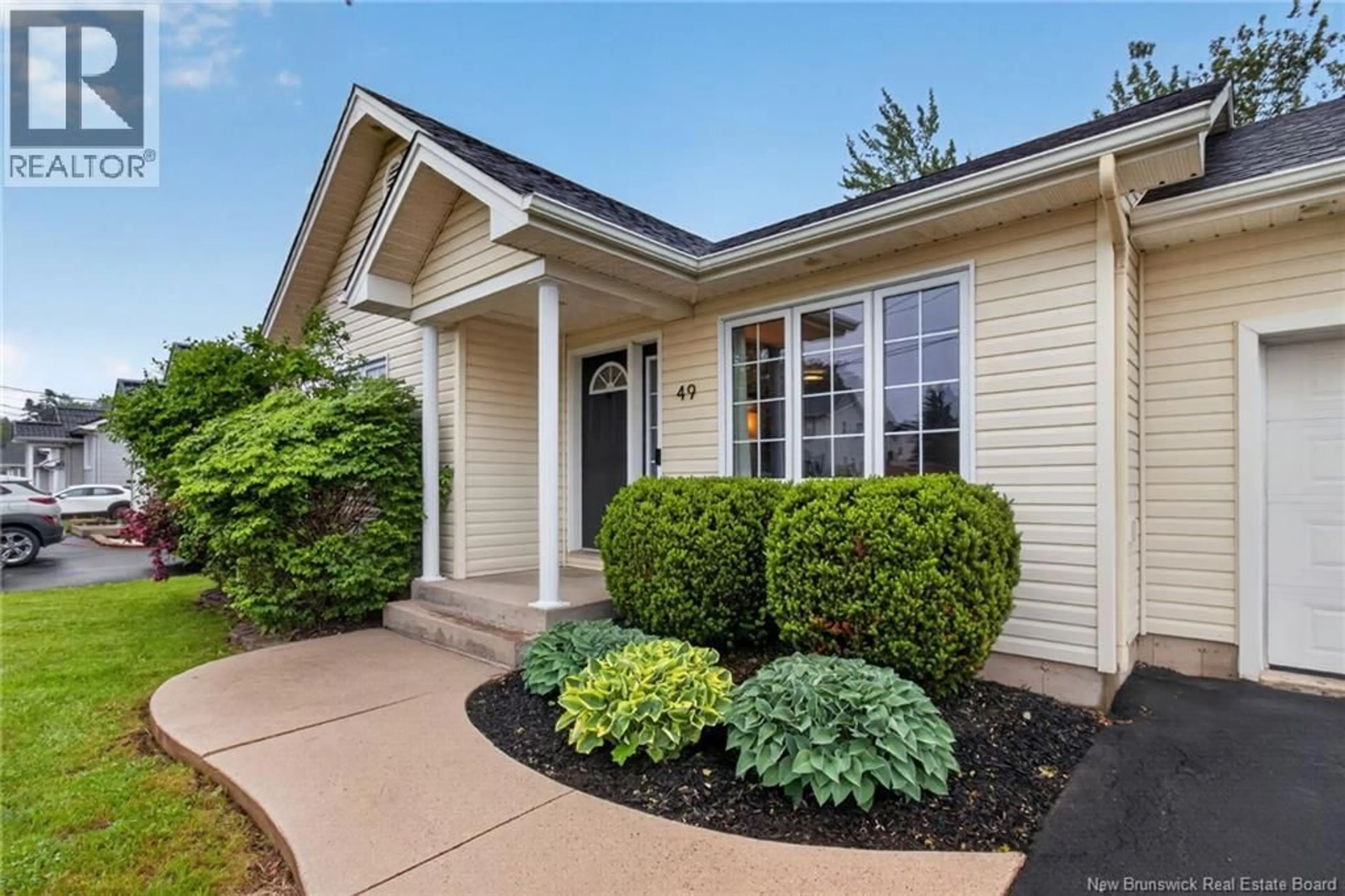 Home with vinyl exterior material, street for 49 MARIN STREET, Dieppe New Brunswick E1A7V8