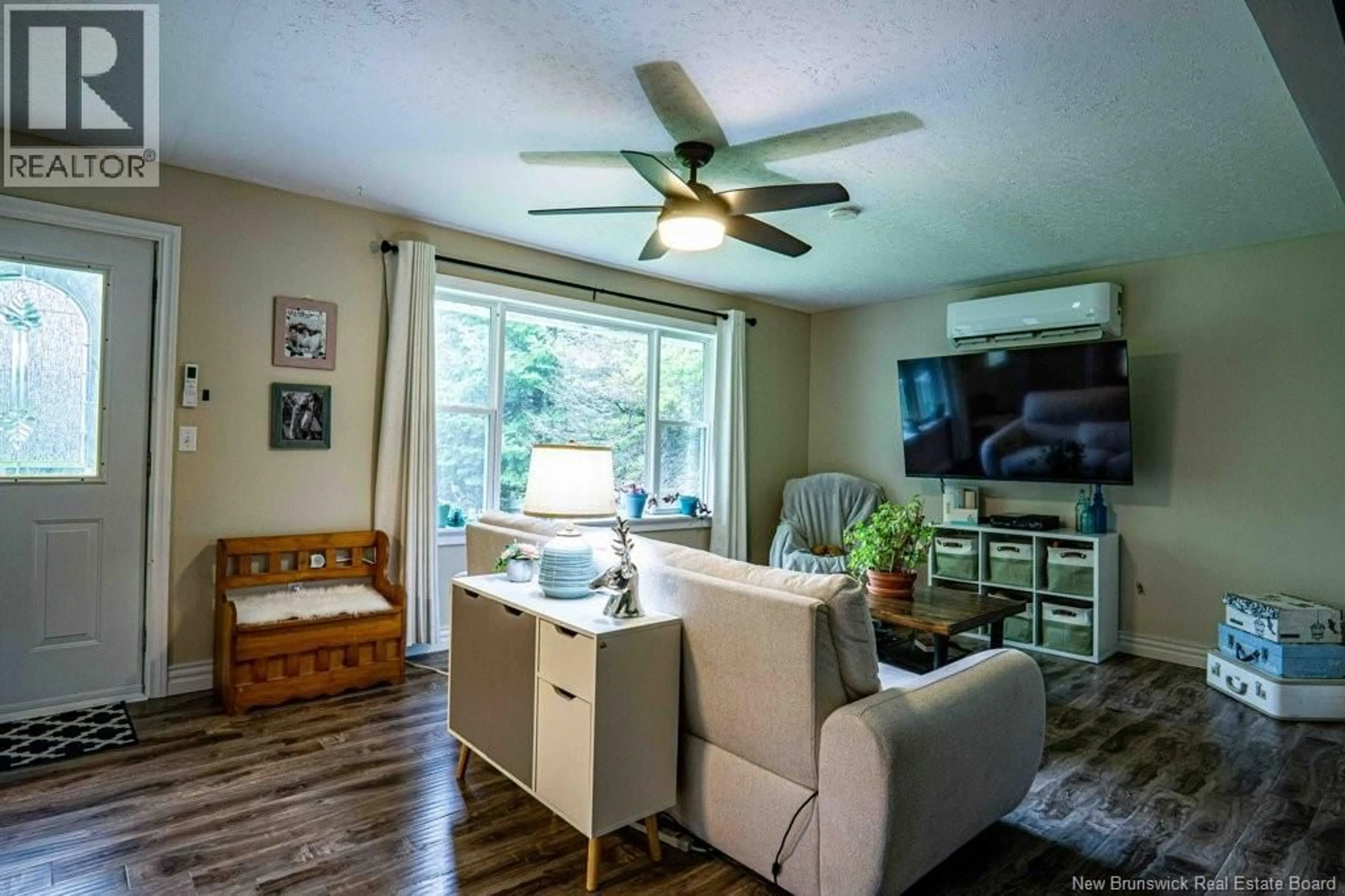 Living room with furniture, wood/laminate floor for 818 ROUTE 104, Burtts Corner New Brunswick E6L2C8
