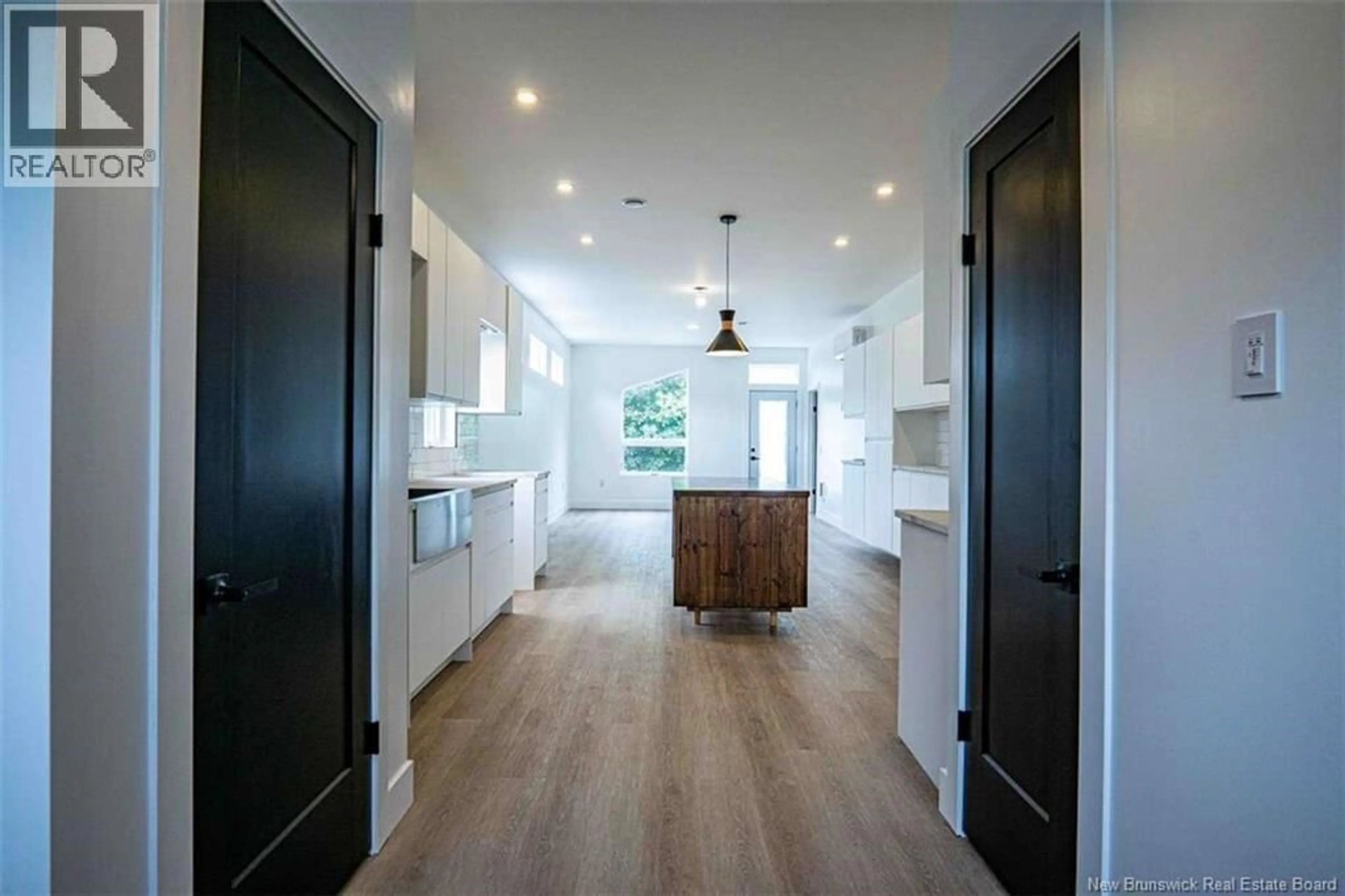 Open concept kitchen, wood/laminate floor for 18 EATON STREET, Milltown New Brunswick E3L1E7