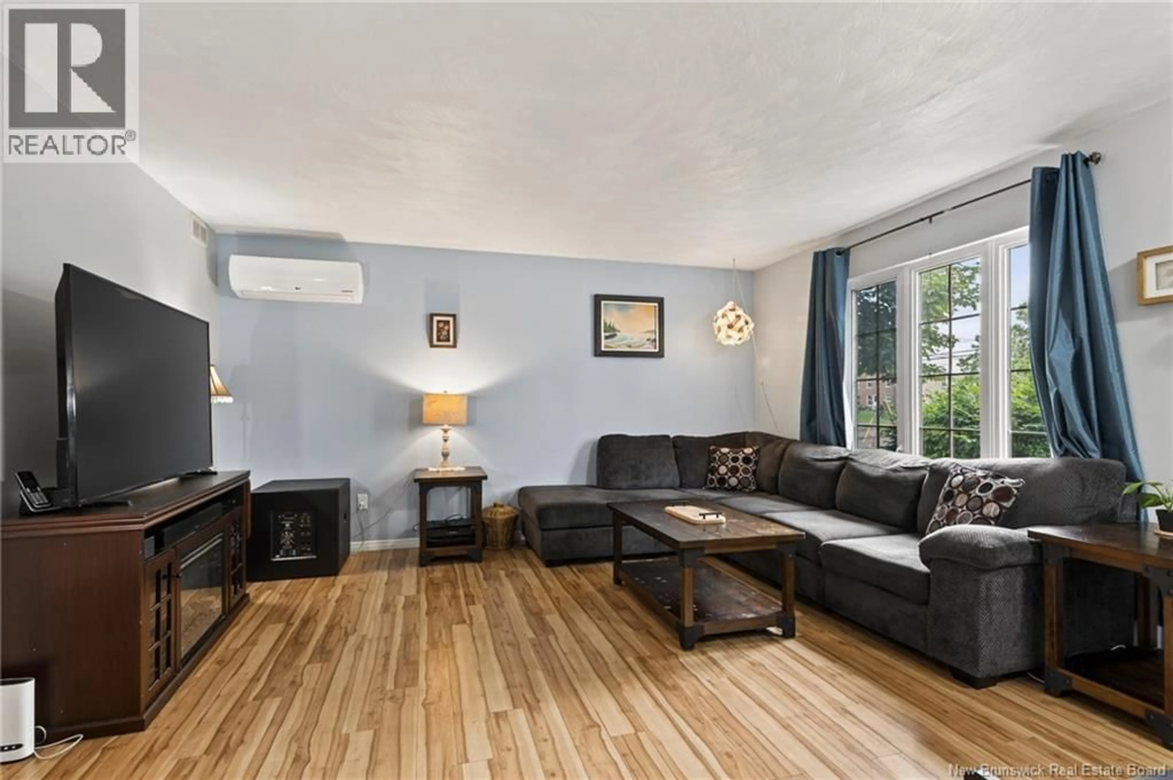 Living room with furniture, wood/laminate floor for 233 KENDRA STREET, Moncton New Brunswick E1C8Y4