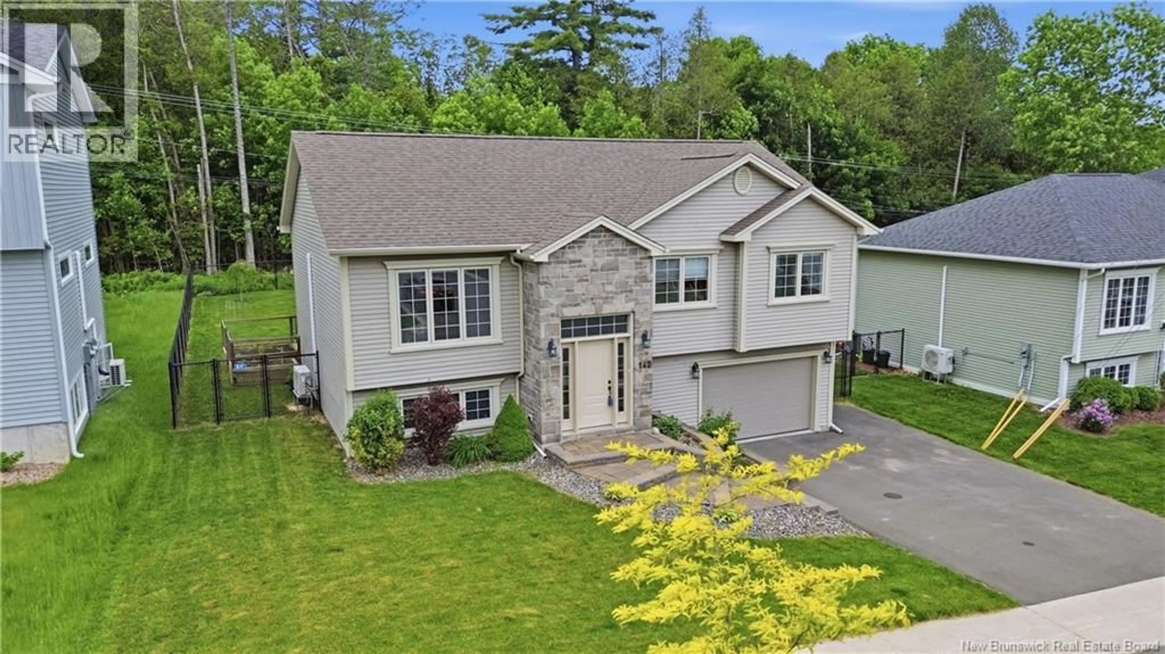 A pic from outside/outdoor area/front of a property/back of a property/a pic from drone, street for 142 MOOERS DRIVE, Fredericton New Brunswick E3C0J6
