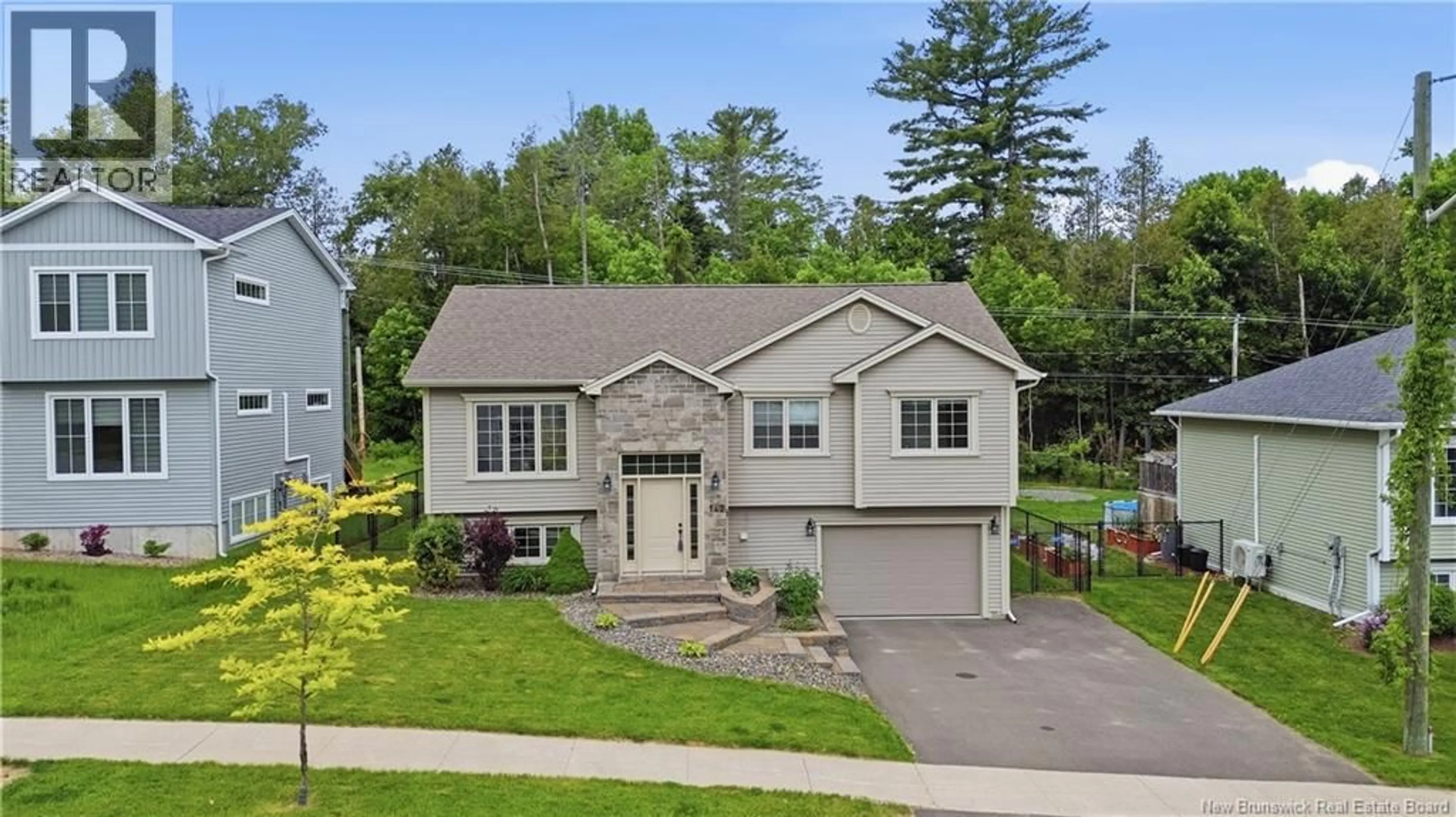 Home with vinyl exterior material, street for 142 MOOERS DRIVE, Fredericton New Brunswick E3C0J6