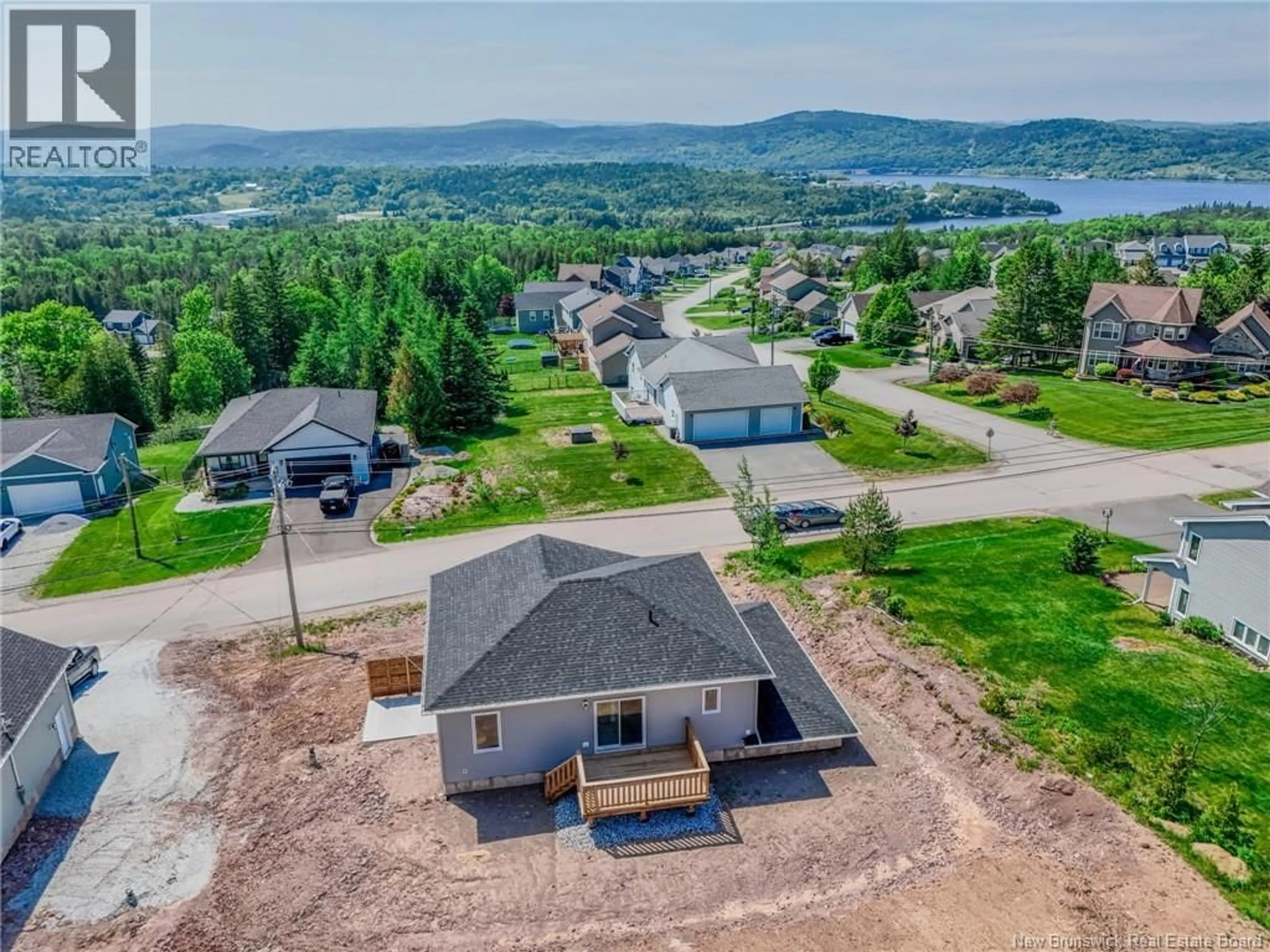 A pic from outside/outdoor area/front of a property/back of a property/a pic from drone, water/lake/river/ocean view for 76 SQUIRE DRIVE, Quispamsis New Brunswick E2G0B5