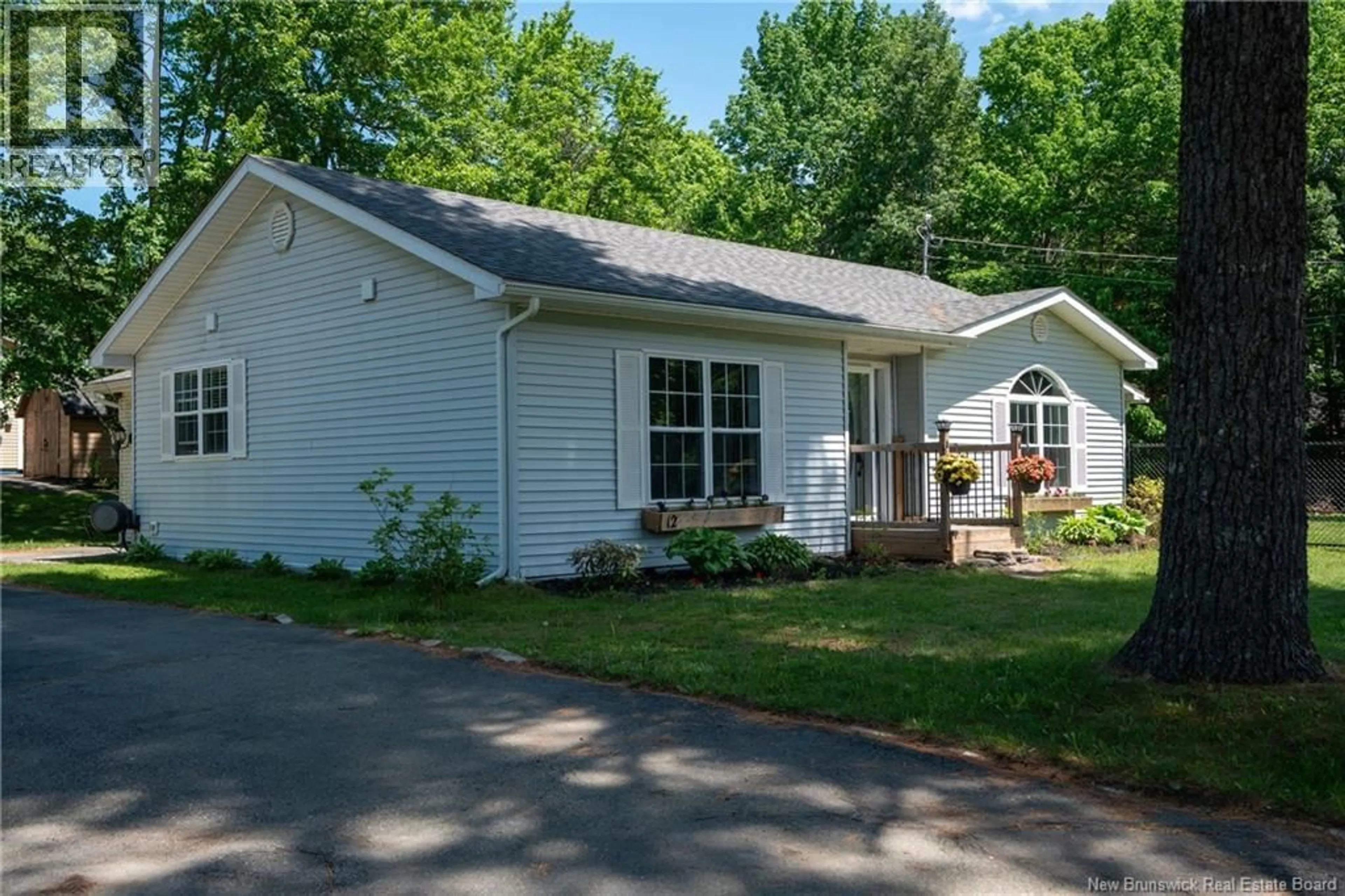 Home with vinyl exterior material, street for 12 LINFIELD LANE, Fredericton New Brunswick E3C1M7