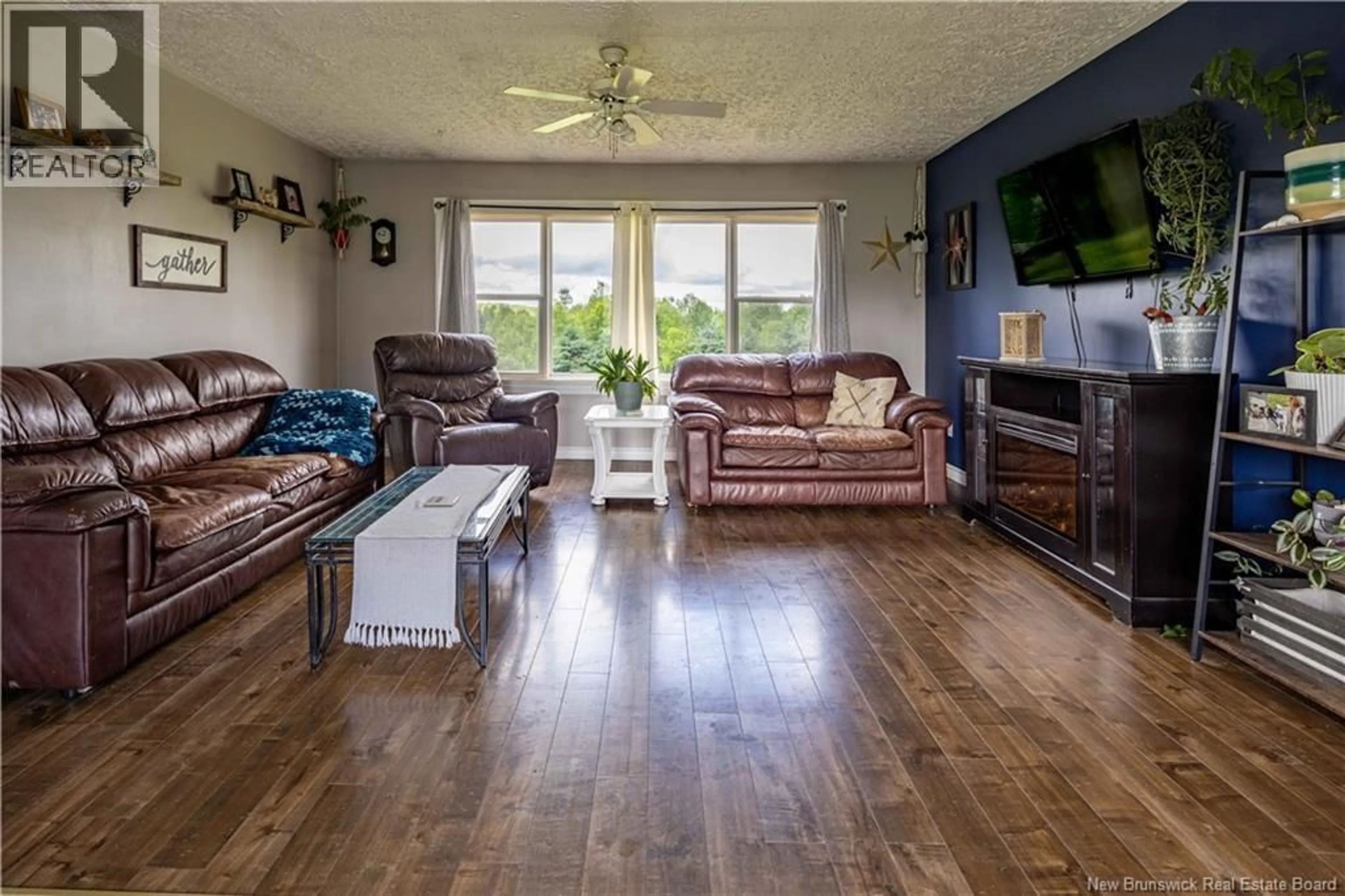 Living room with furniture, wood/laminate floor for 138 580 ROUTE, Windsor New Brunswick E7L4M8