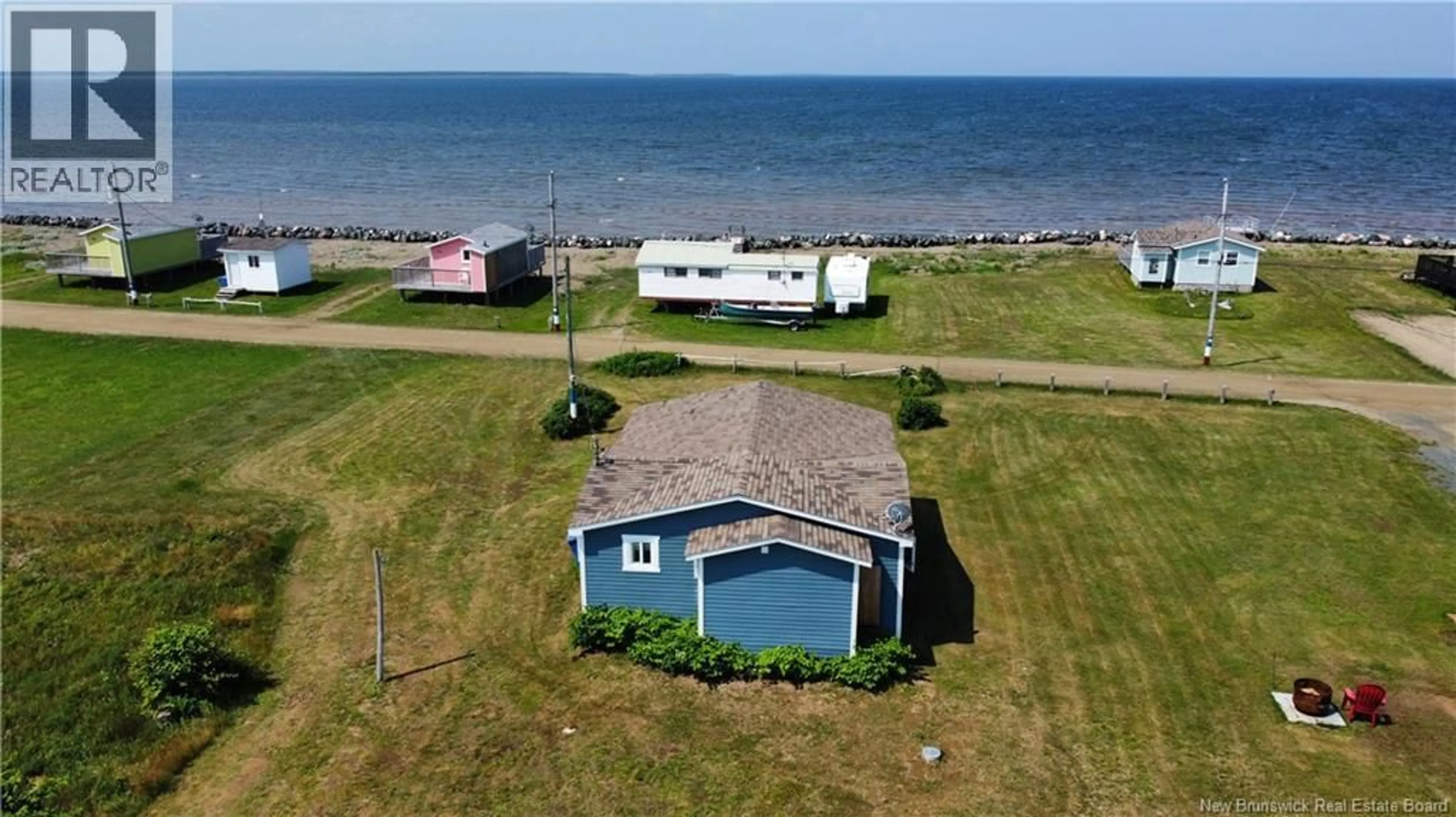 A pic from outside/outdoor area/front of a property/back of a property/a pic from drone, water/lake/river/ocean view for 22 MAXIMIN, Lamèque Island New Brunswick E8T0G7