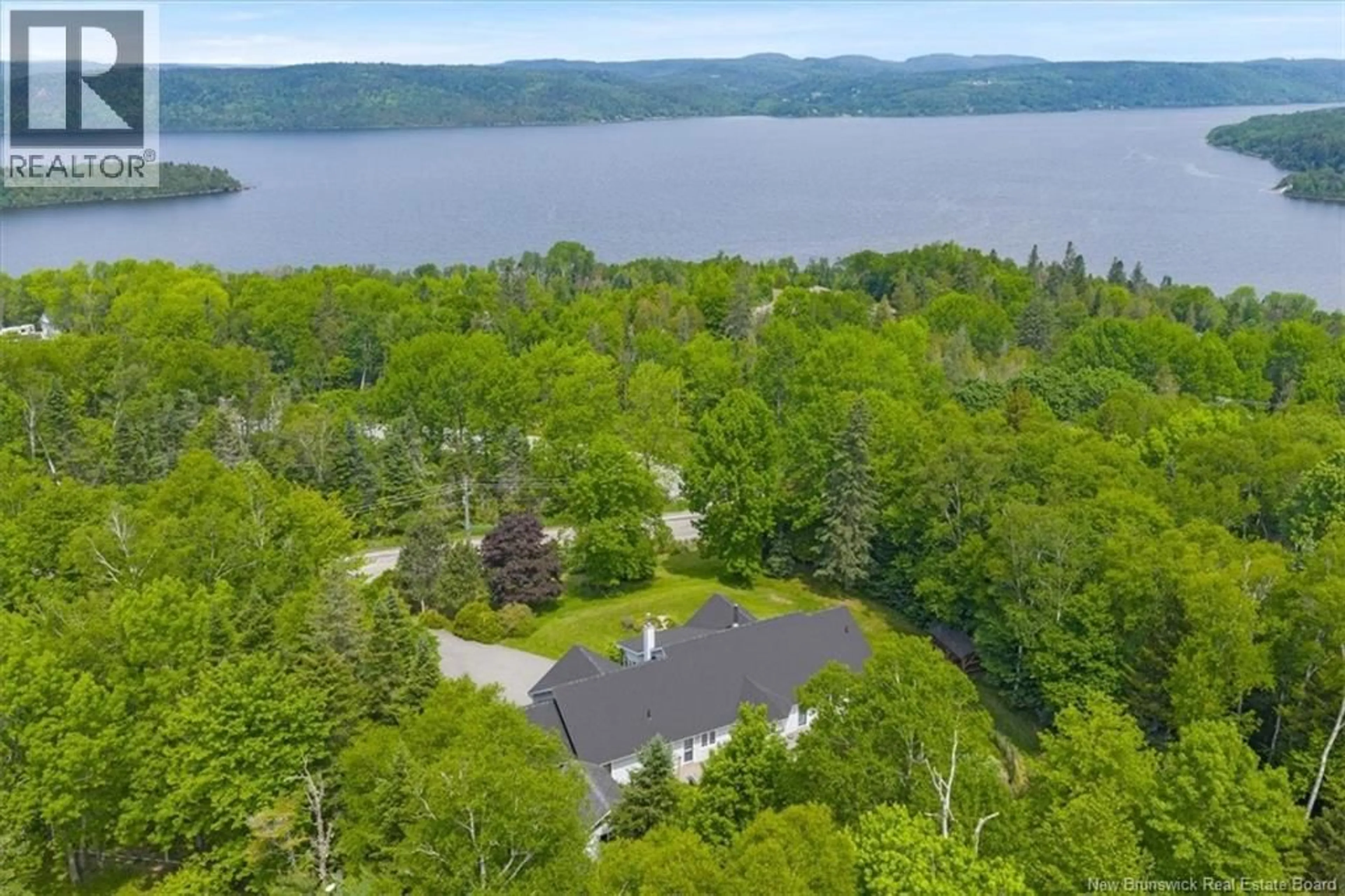 A pic from outside/outdoor area/front of a property/back of a property/a pic from drone, water/lake/river/ocean view for 160 MEENANS COVE ROAD, Quispamsis New Brunswick E2G1Z4