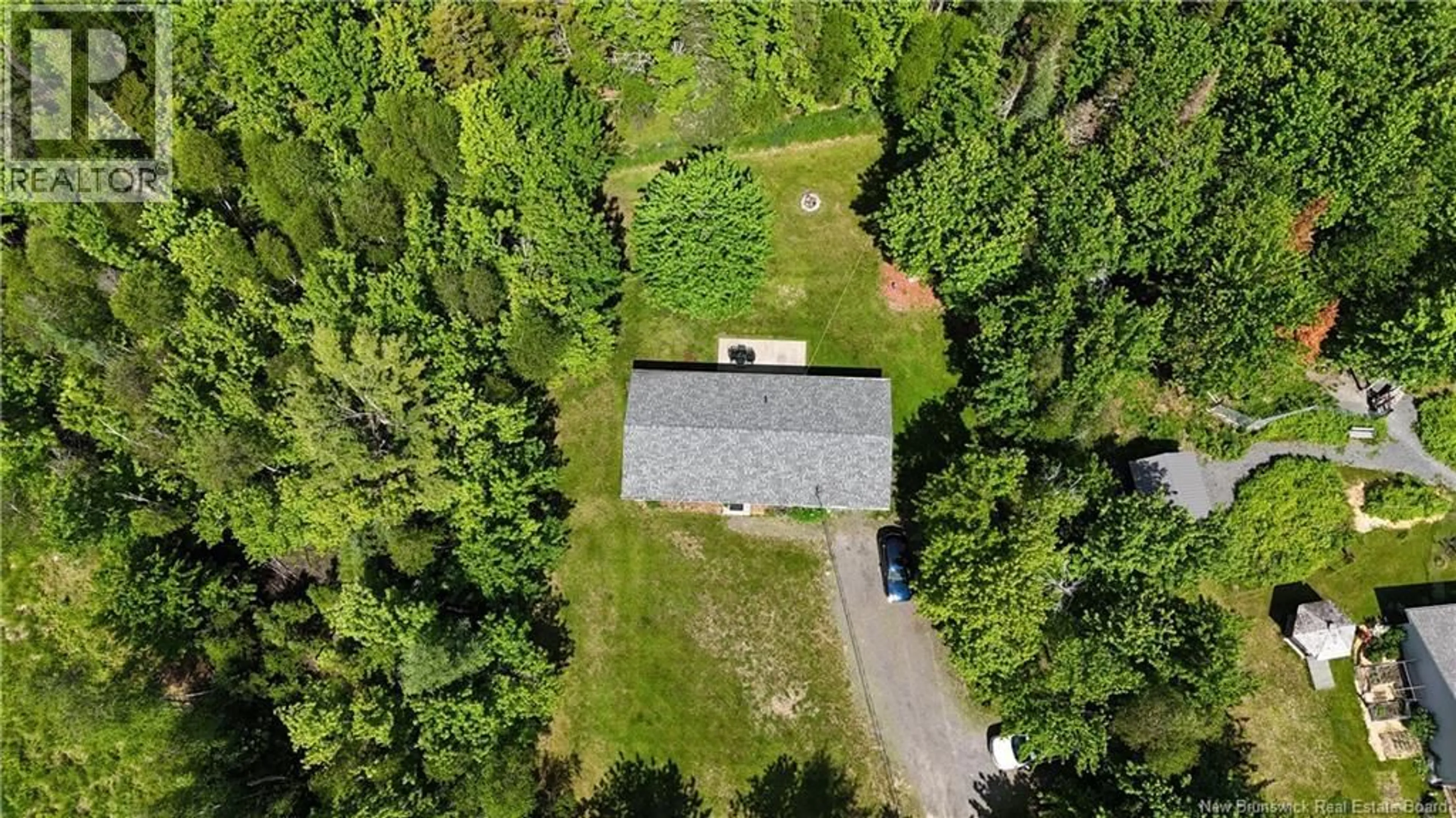 A pic from outside/outdoor area/front of a property/back of a property/a pic from drone, forest/trees view for 15 KATIE AVENUE, Douglas New Brunswick E3G7Z8
