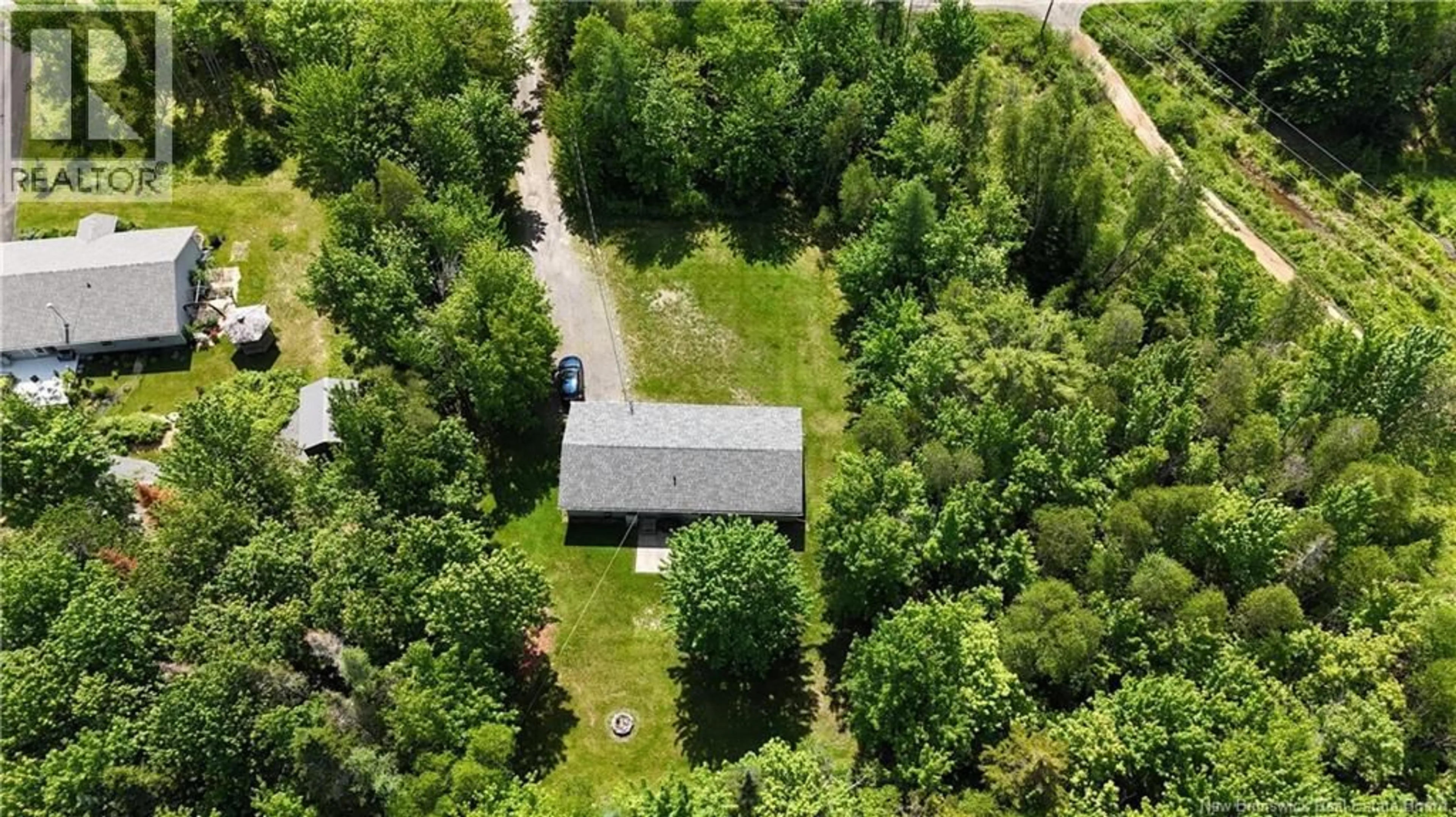 A pic from outside/outdoor area/front of a property/back of a property/a pic from drone, forest/trees view for 15 KATIE AVENUE, Douglas New Brunswick E3G7Z8