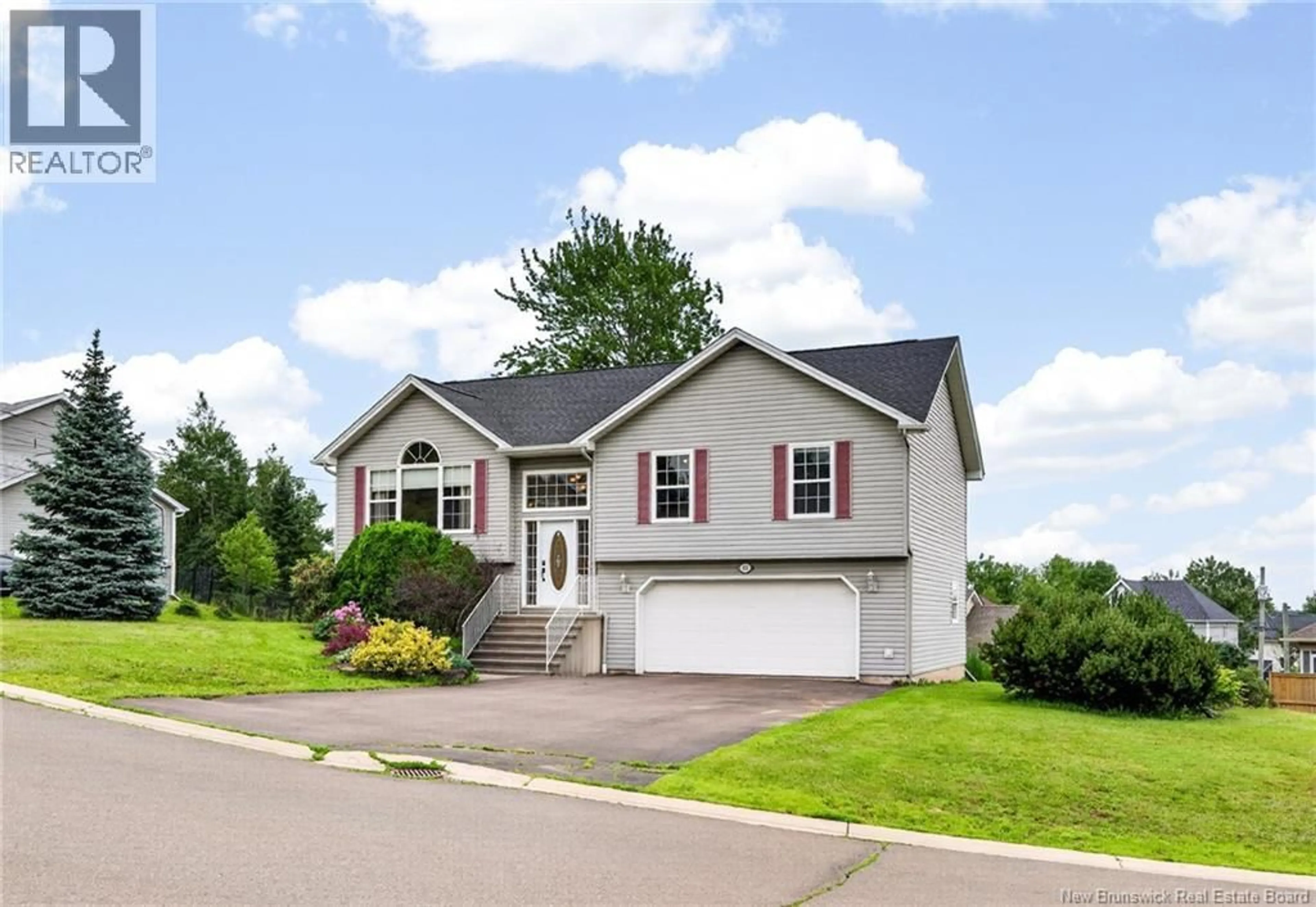 Home with vinyl exterior material, street for 111 MEUNIER, Dieppe New Brunswick E1A7W9