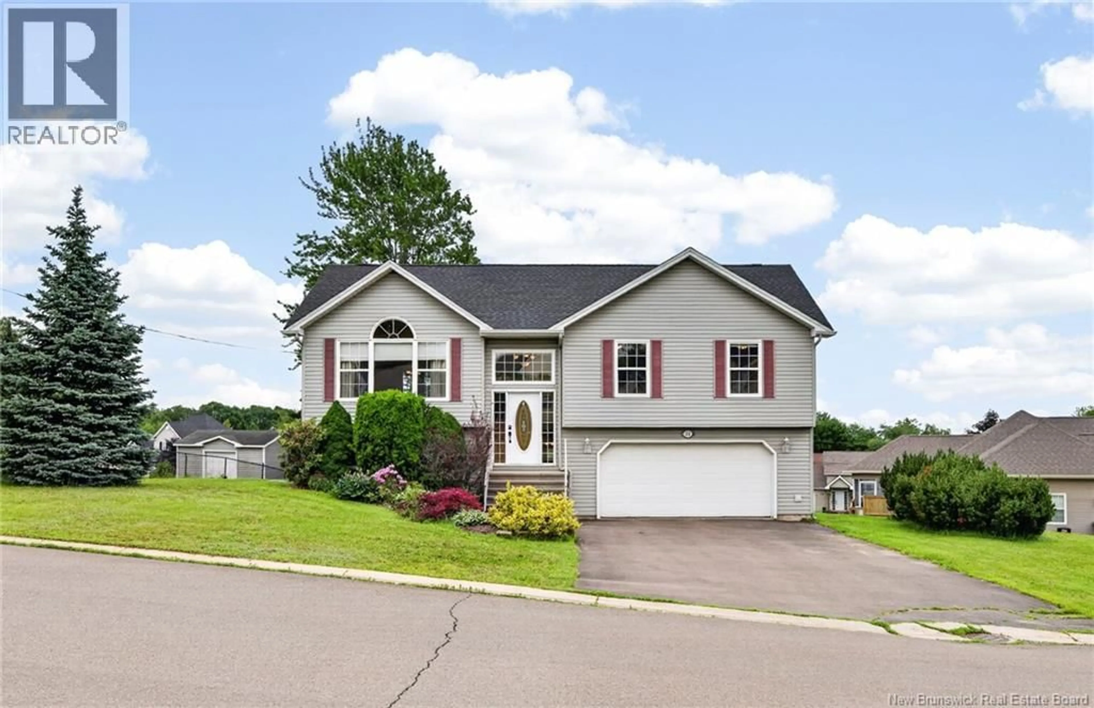 Home with vinyl exterior material, street for 111 MEUNIER, Dieppe New Brunswick E1A7W9