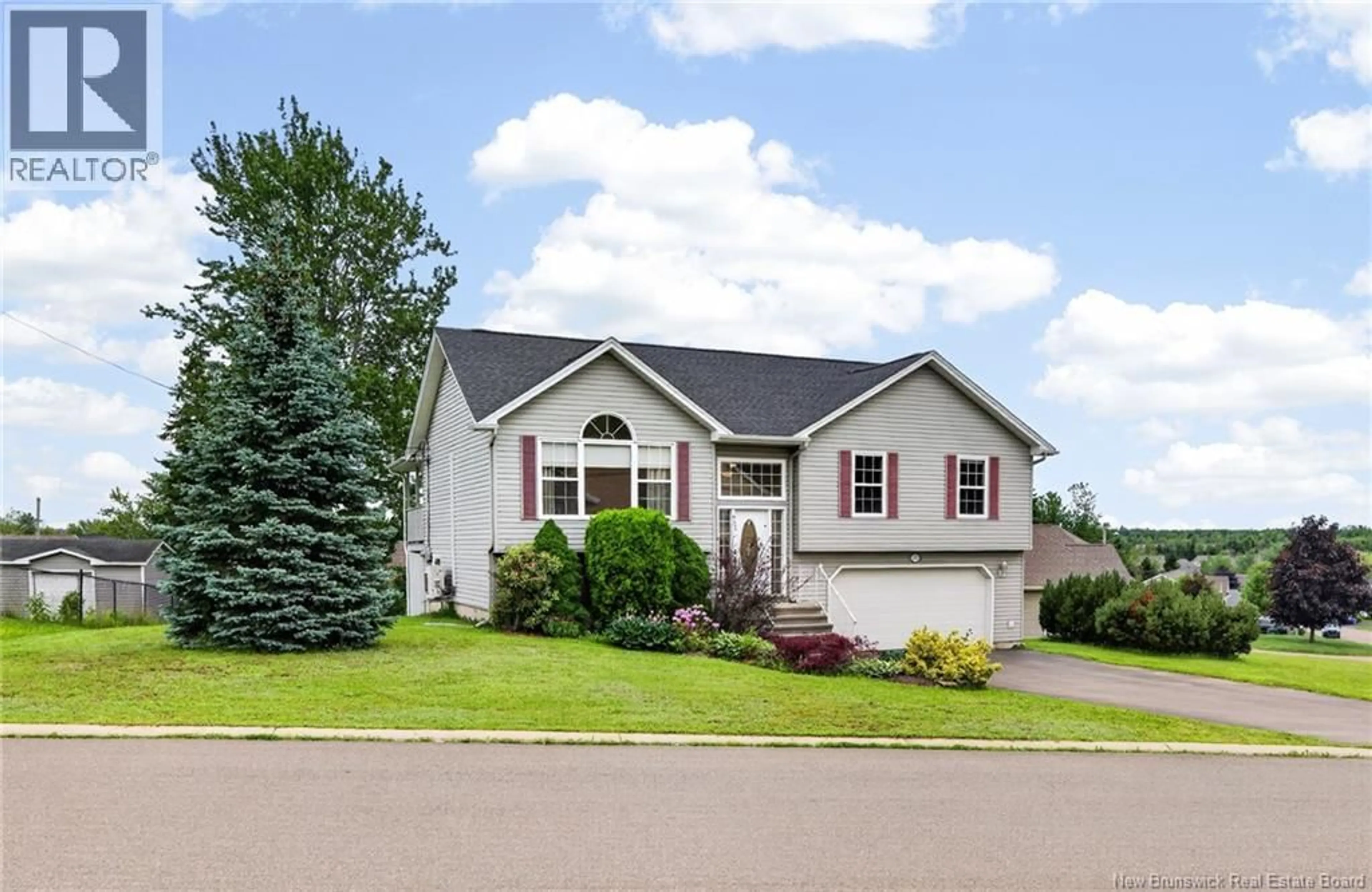 Home with vinyl exterior material, street for 111 MEUNIER, Dieppe New Brunswick E1A7W9