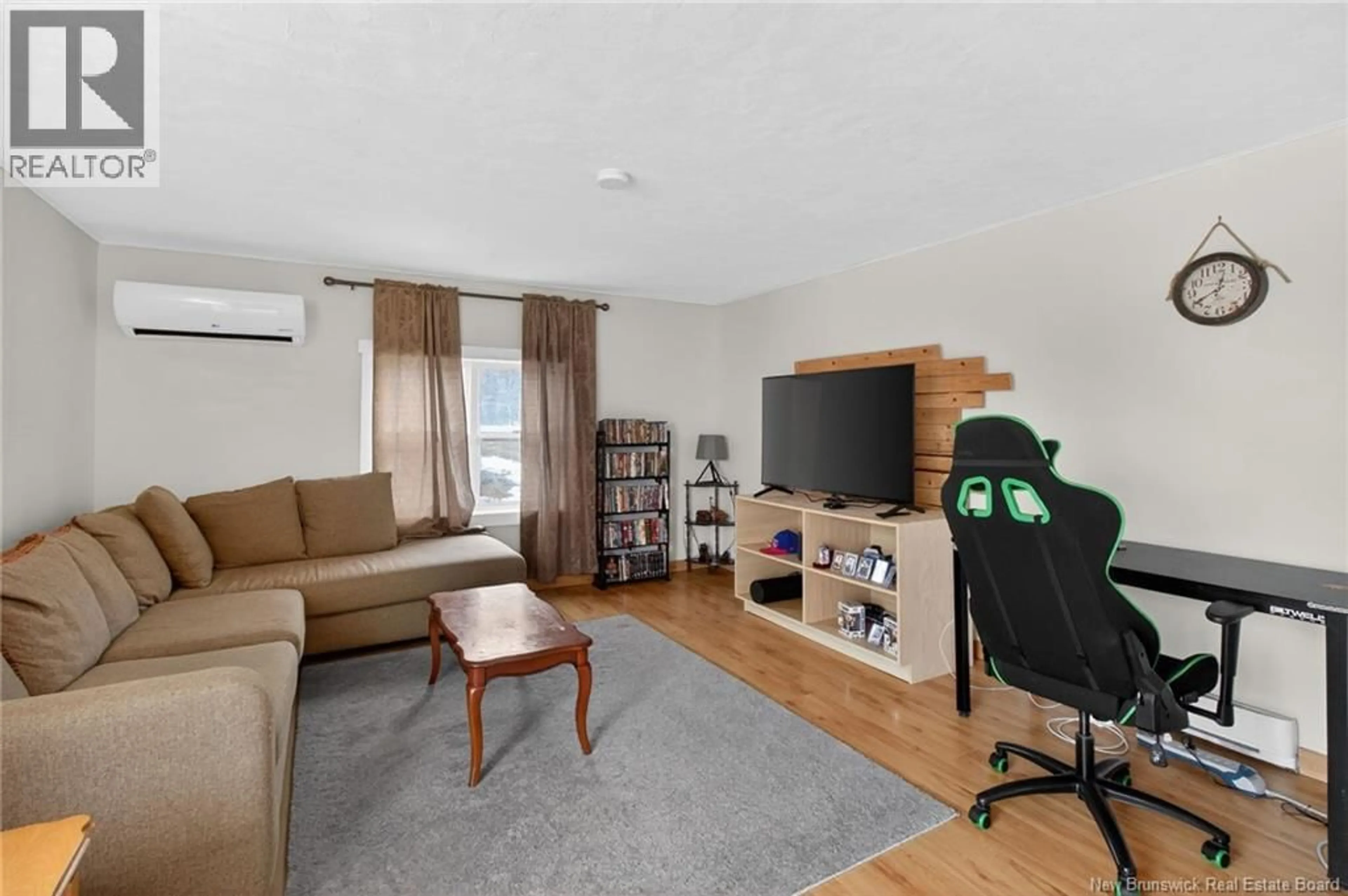 Living room with furniture, wood/laminate floor for 3351 ROUTE 132, Scoudouc New Brunswick E4P3S1