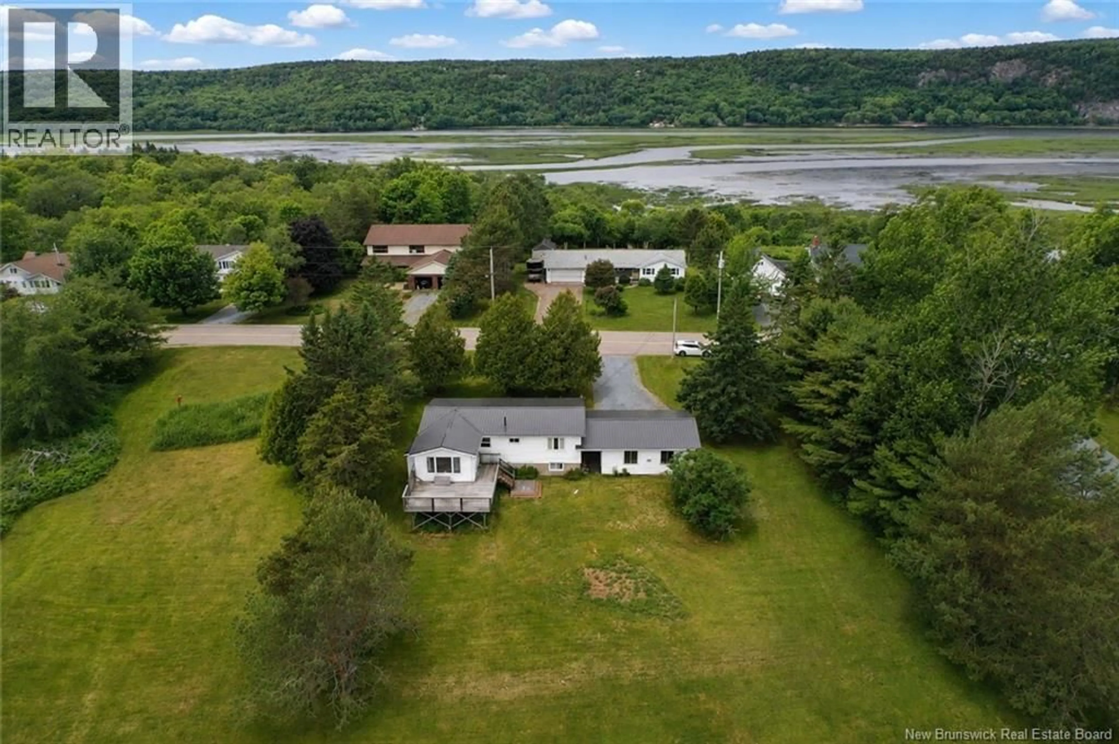 A pic from outside/outdoor area/front of a property/back of a property/a pic from drone, water/lake/river/ocean view for 136 NECK ROAD, Quispamsis New Brunswick E2G1K8