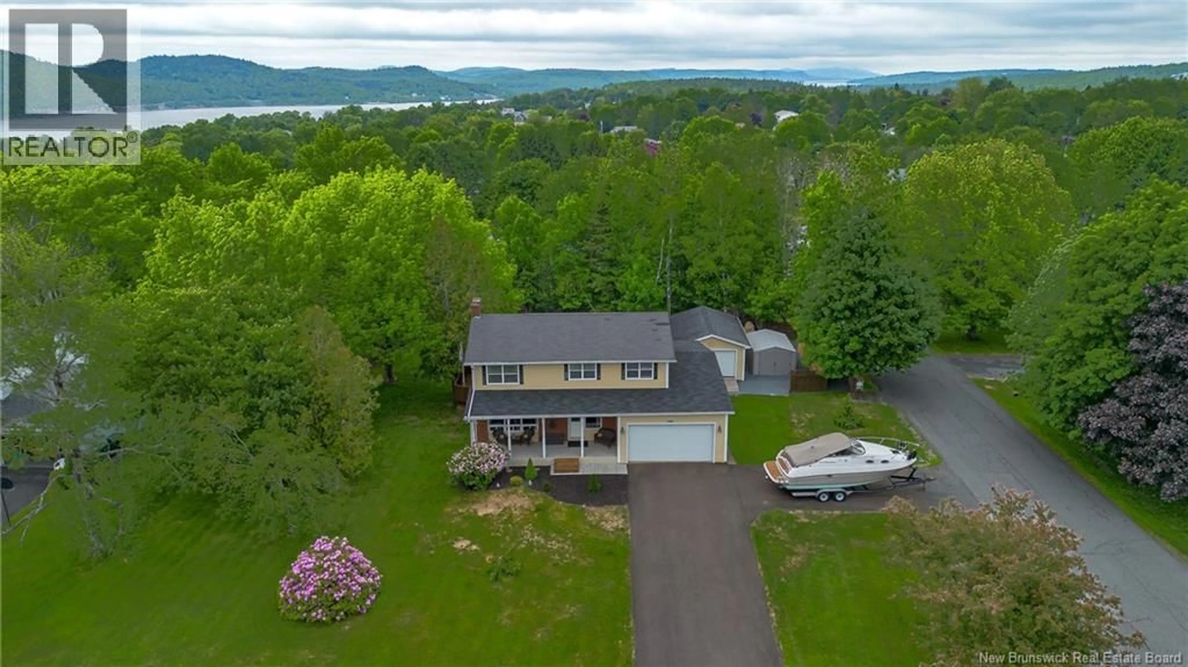 A pic from outside/outdoor area/front of a property/back of a property/a pic from drone, water/lake/river/ocean view for 127 SHERWOOD DRIVE, Quispamsis New Brunswick E2E1G8