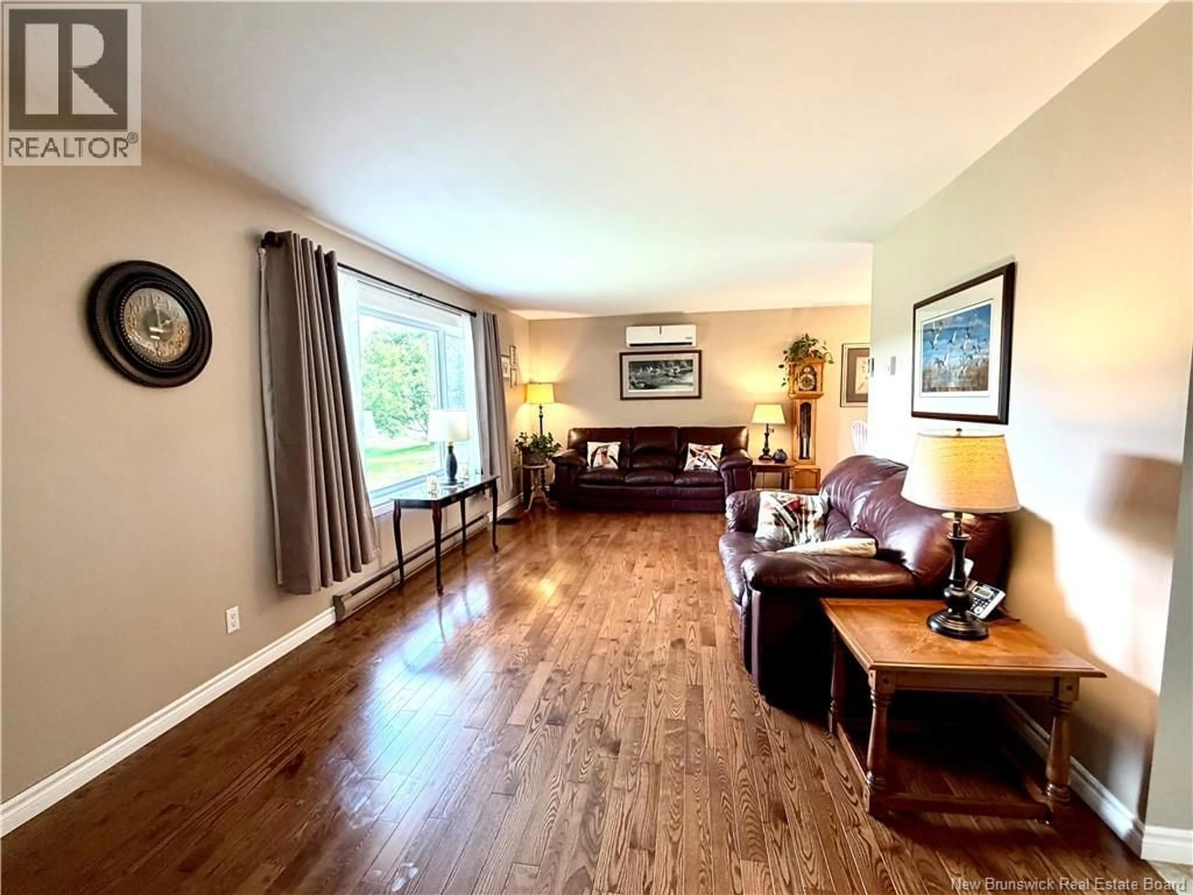 Living room with furniture, wood/laminate floor for 129 INGLEWOOD DRIVE, Grand Bay-Westfield New Brunswick E5K2E4