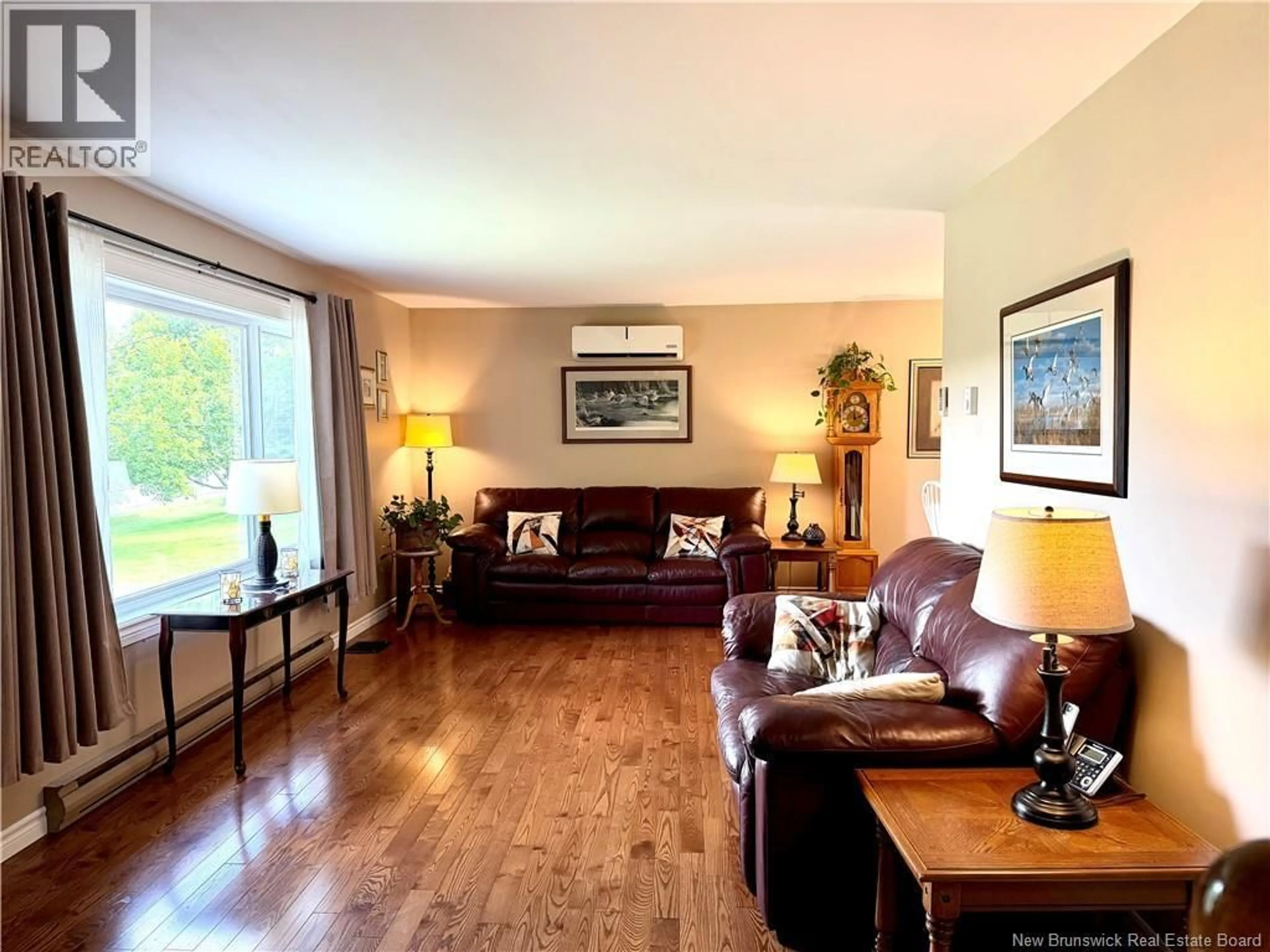 Living room with furniture, wood/laminate floor for 129 INGLEWOOD DRIVE, Grand Bay-Westfield New Brunswick E5K2E4