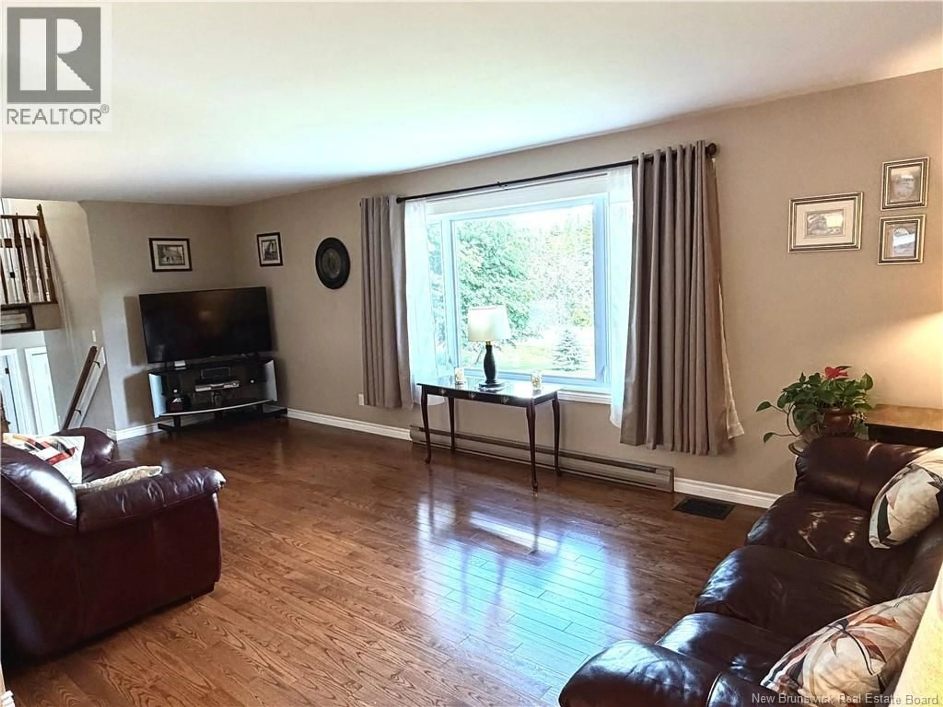 Living room with furniture, wood/laminate floor for 129 INGLEWOOD DRIVE, Grand Bay-Westfield New Brunswick E5K2E4