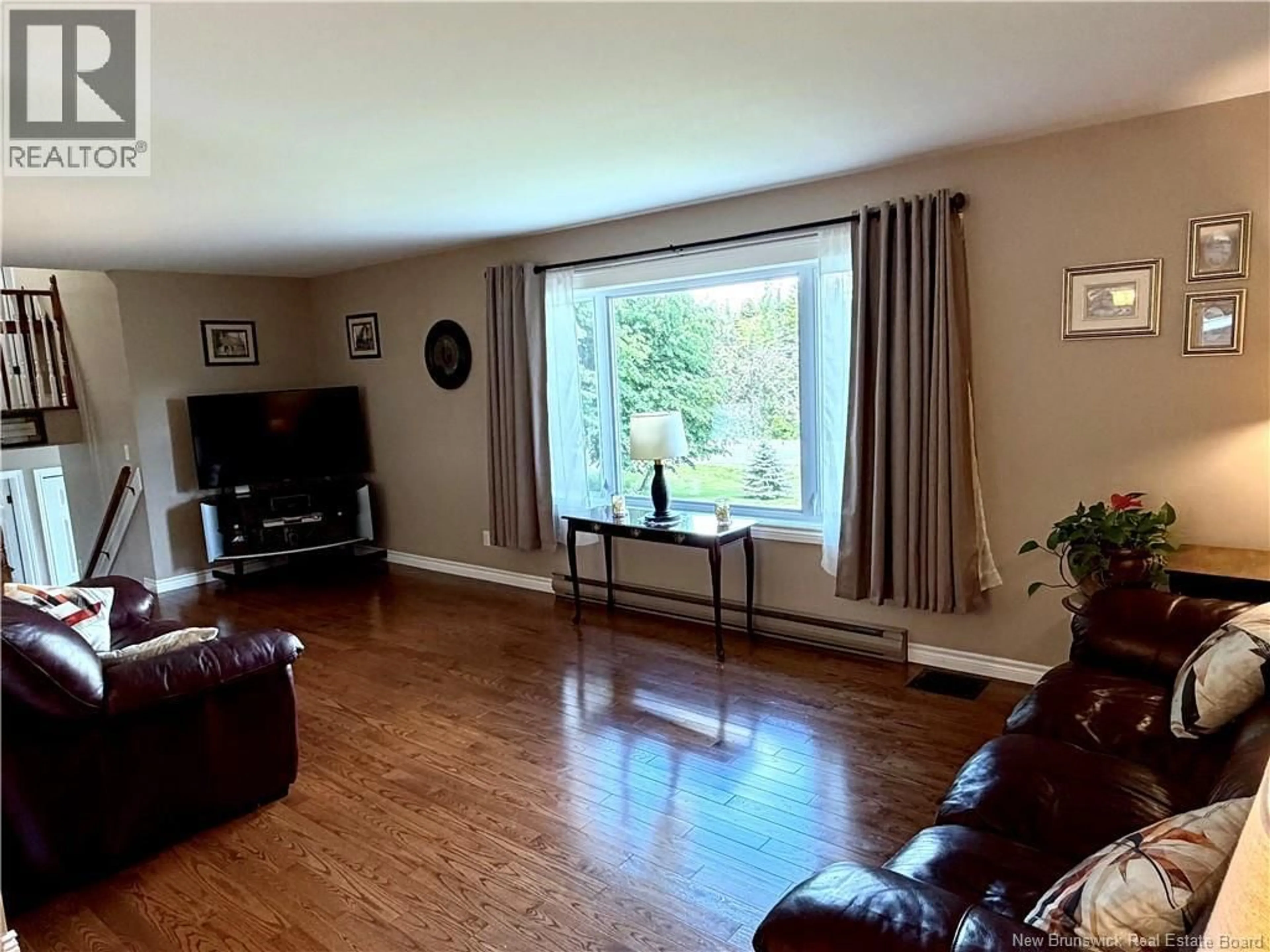 Living room with furniture, wood/laminate floor for 129 INGLEWOOD DRIVE, Grand Bay-Westfield New Brunswick E5K2E4