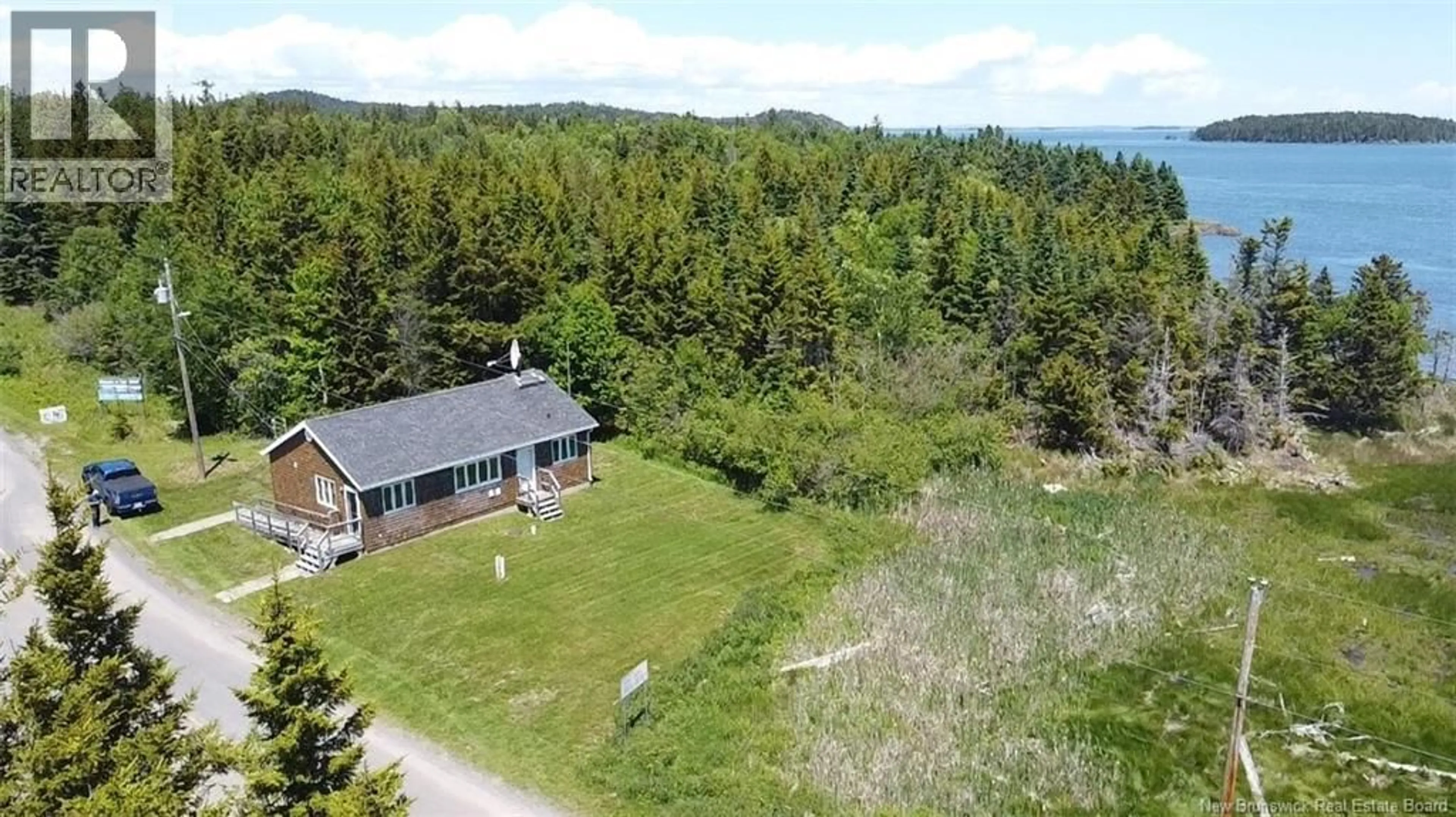 A pic from outside/outdoor area/front of a property/back of a property/a pic from drone, unknown for 175 DEER ISLAND POINT ROAD, Cummings Cove New Brunswick E5V1G5