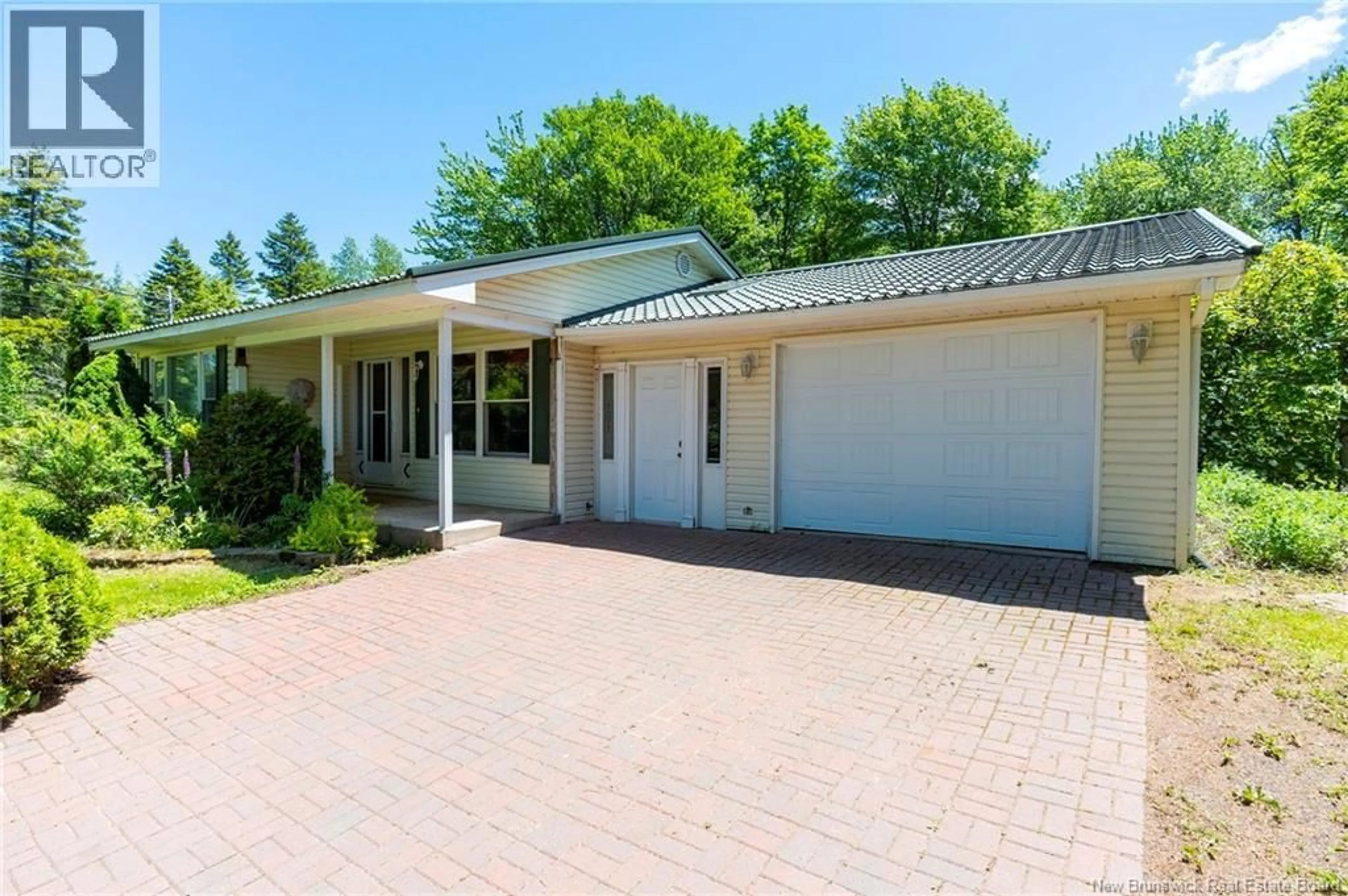 Home with vinyl exterior material, street for 3133 ROUTE 115, Notre-Dame New Brunswick E4V2C3