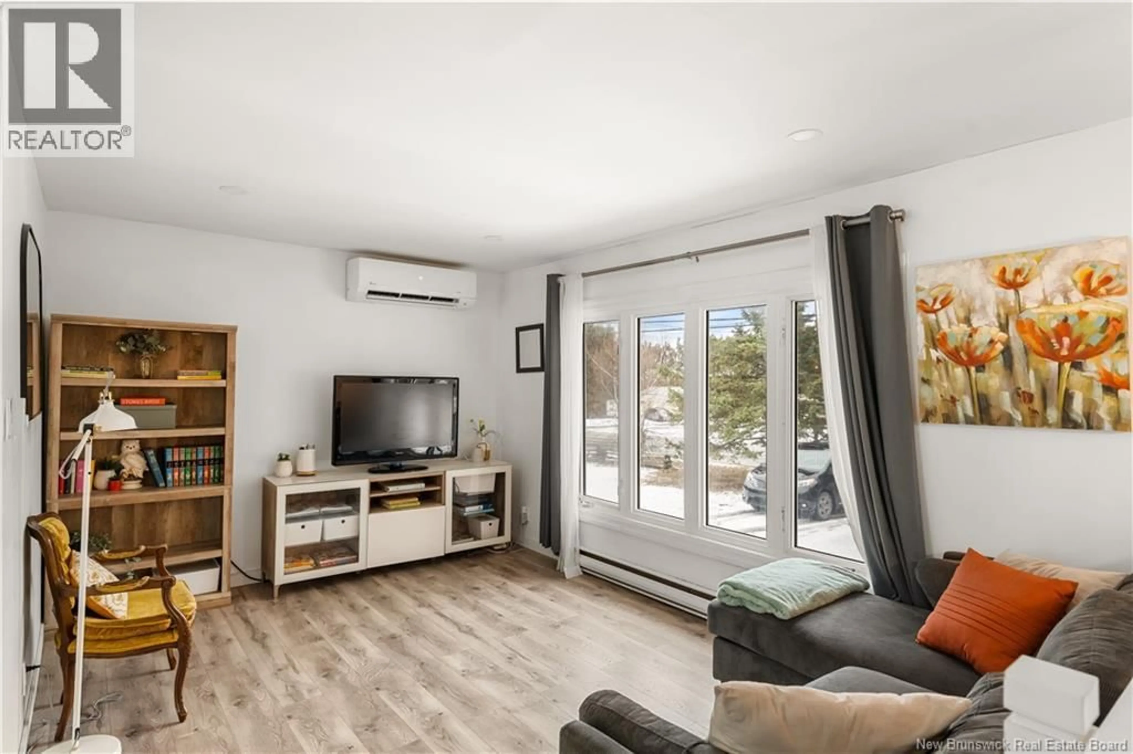 Living room with furniture, wood/laminate floor for 857 MAPLETON ROAD, Moncton New Brunswick E1G2K6