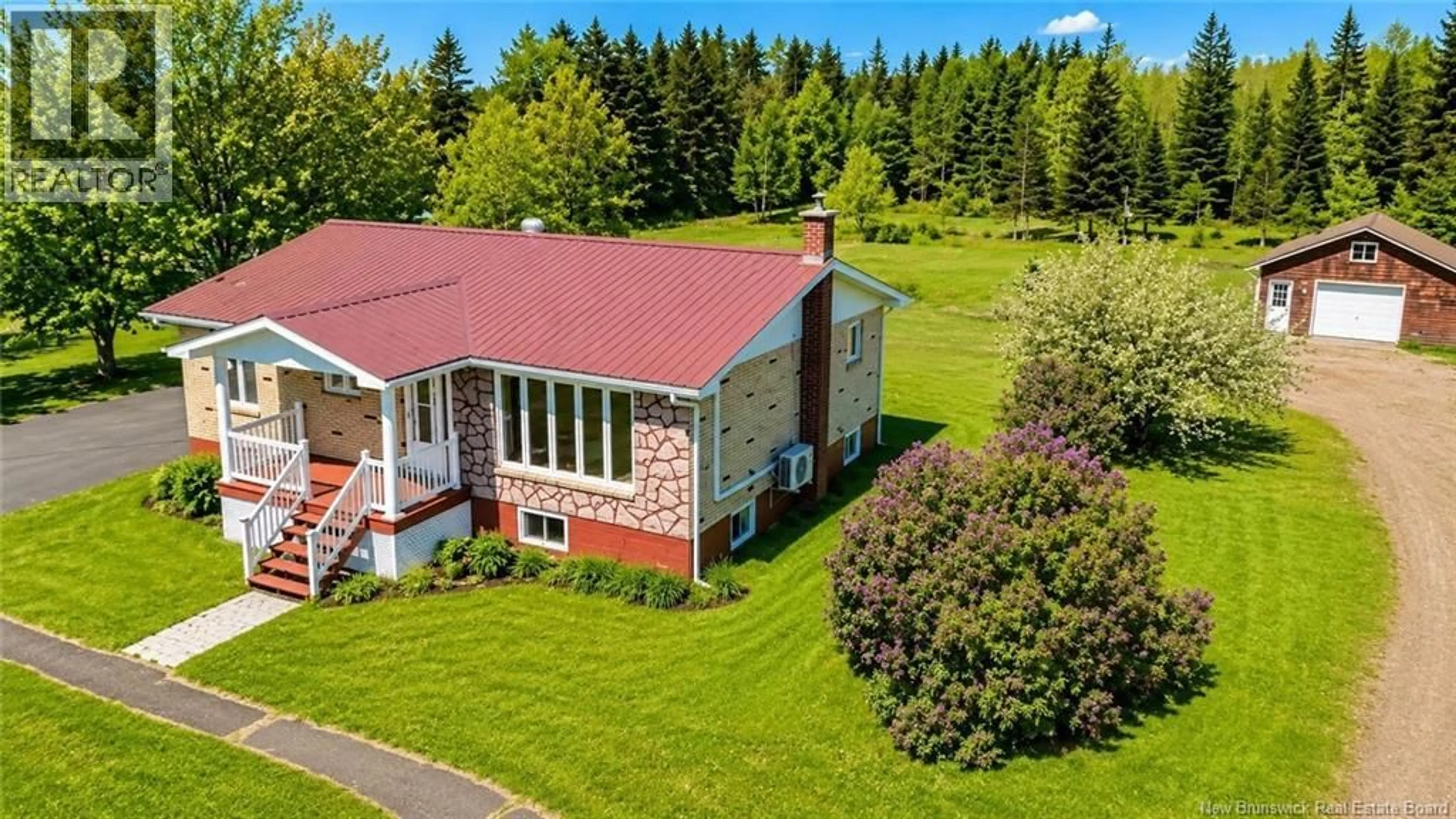 A pic from outside/outdoor area/front of a property/back of a property/a pic from drone, unknown for 5089 RTE 11 HWY, Brantville New Brunswick E1C8T6