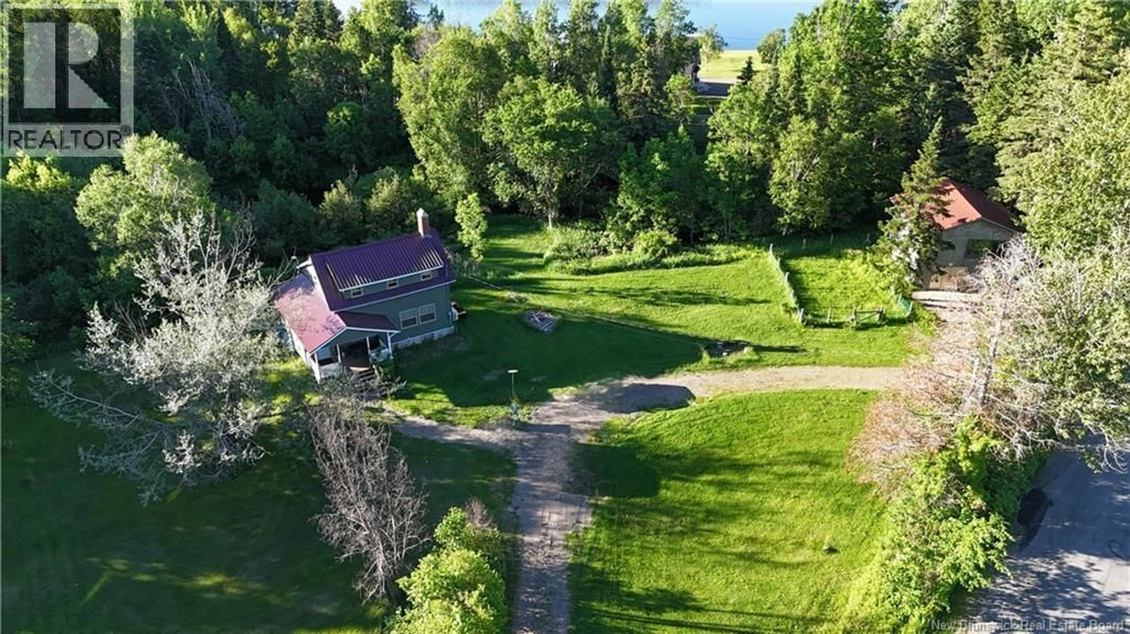 A pic from outside/outdoor area/front of a property/back of a property/a pic from drone, water/lake/river/ocean view for 3 FERRIS ROAD, Red Rapids New Brunswick E7H2A1