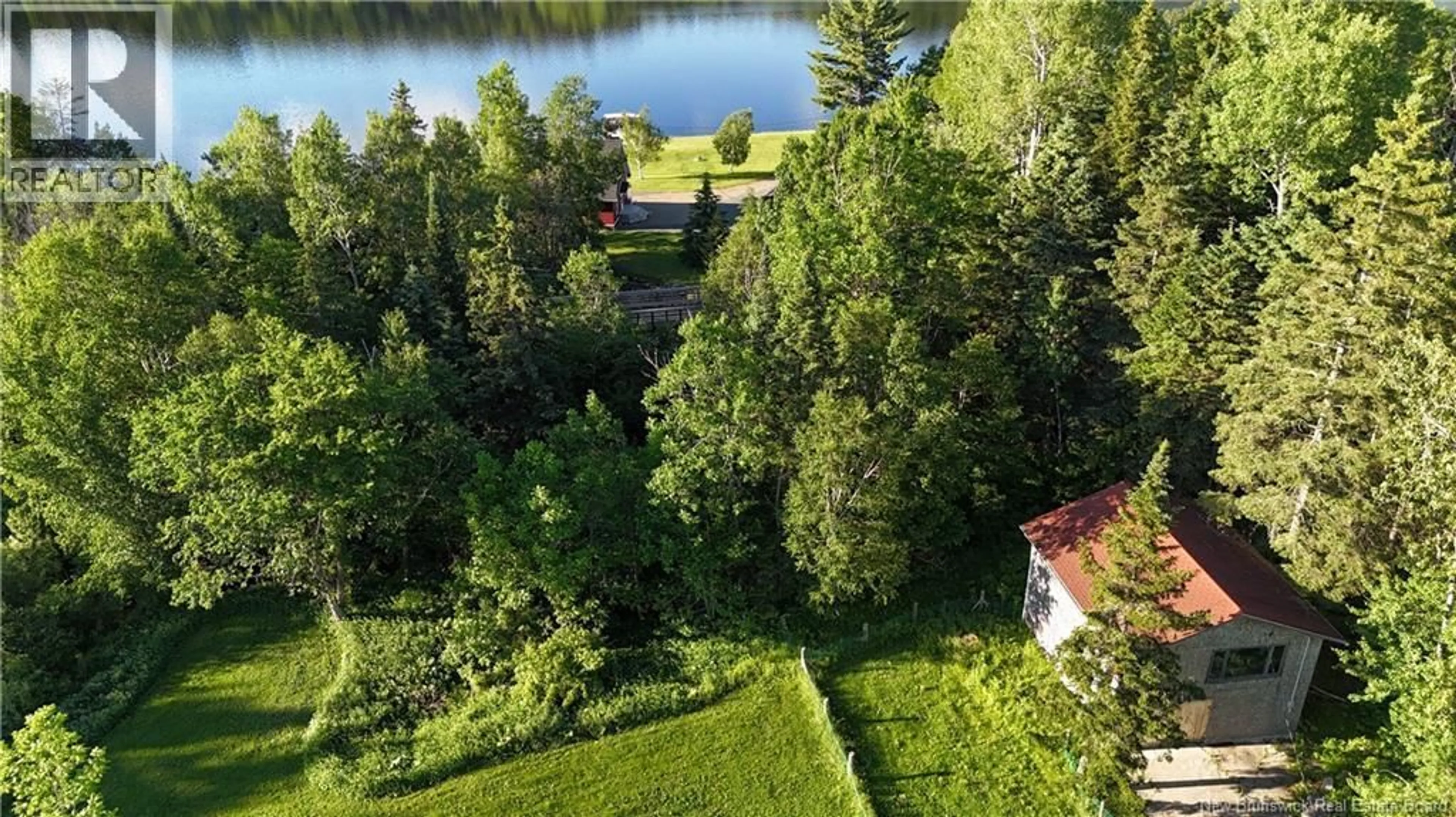 A pic from outside/outdoor area/front of a property/back of a property/a pic from drone, water/lake/river/ocean view for 3 FERRIS ROAD, Red Rapids New Brunswick E7H2A1