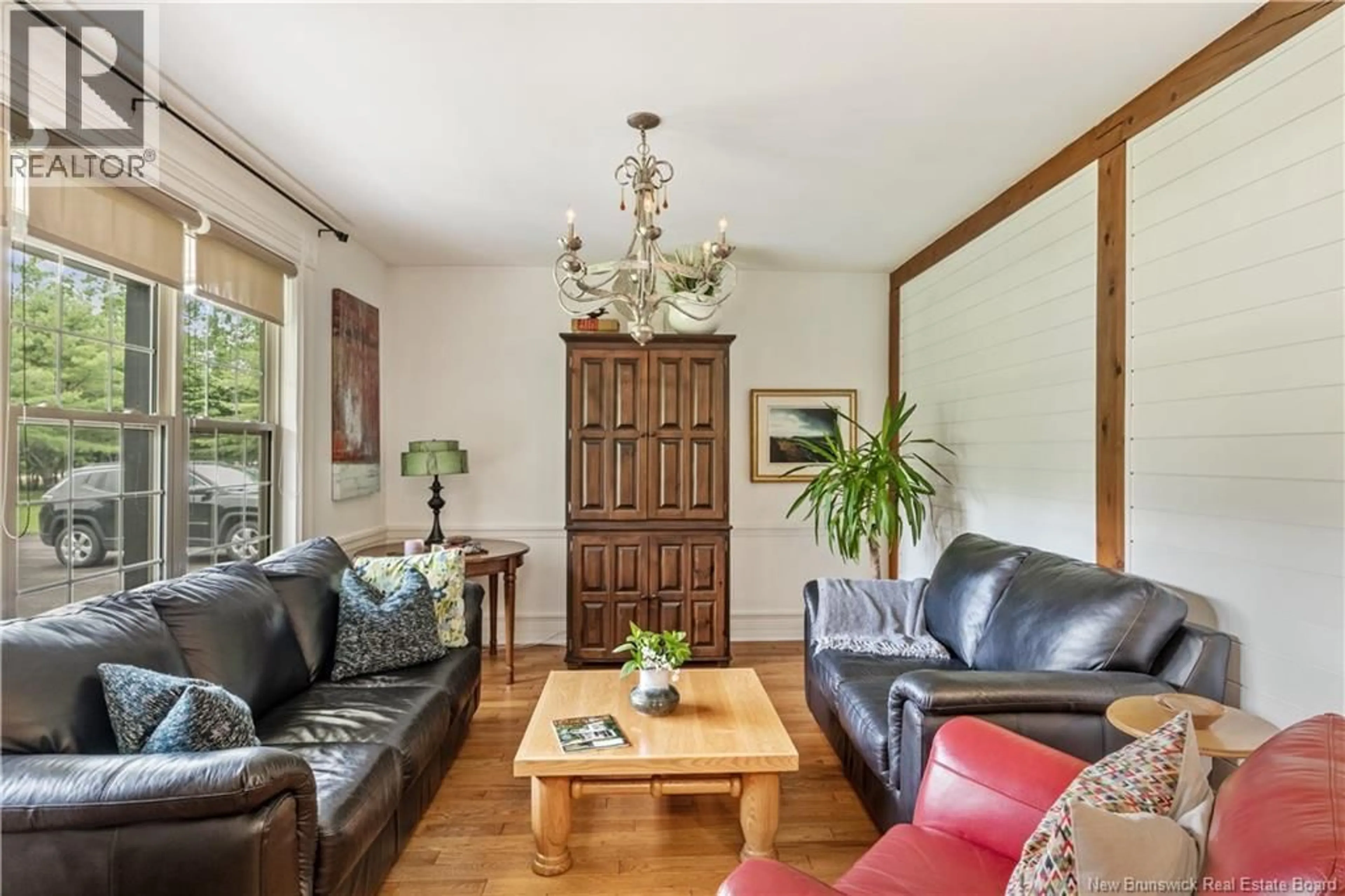 Living room with furniture, wood/laminate floor for 1580 MELANSON, Dieppe New Brunswick E1H2B8