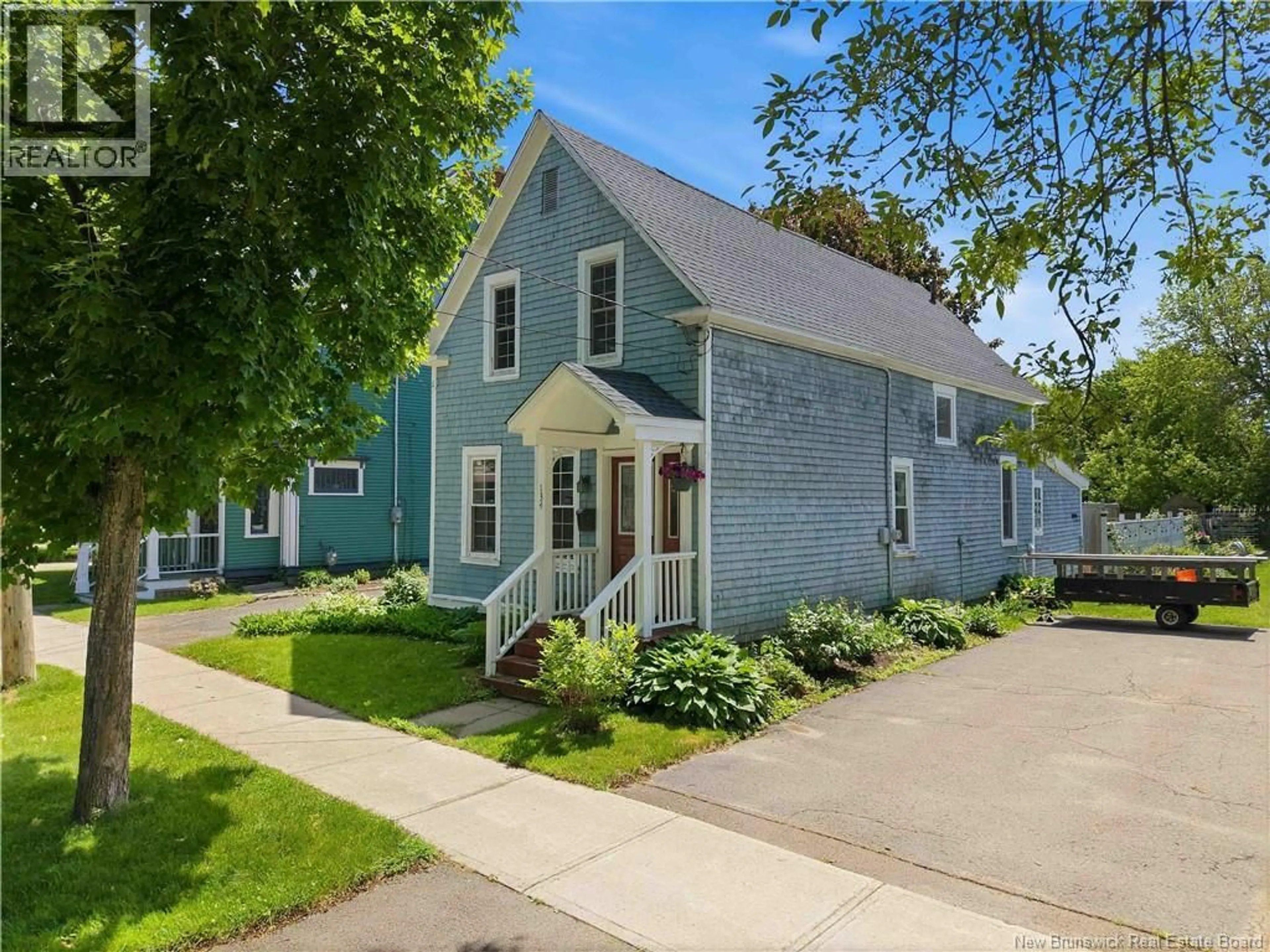 Home with vinyl exterior material, street for 134 CHARLOTTE STREET, Fredericton New Brunswick E3B1L2
