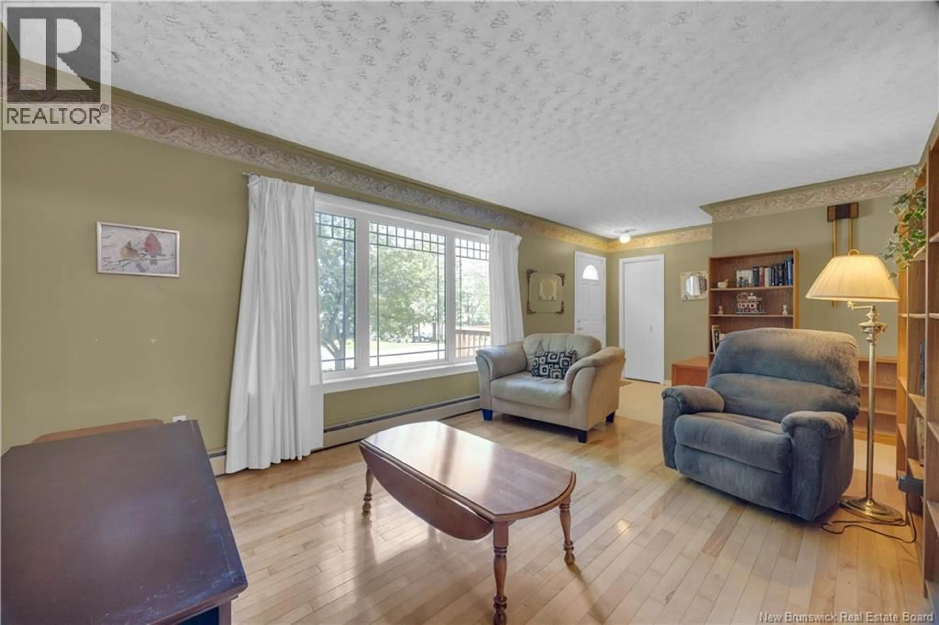 Living room with furniture, wood/laminate floor for 14 RIVER ROAD, Rothesay New Brunswick E2E2C4