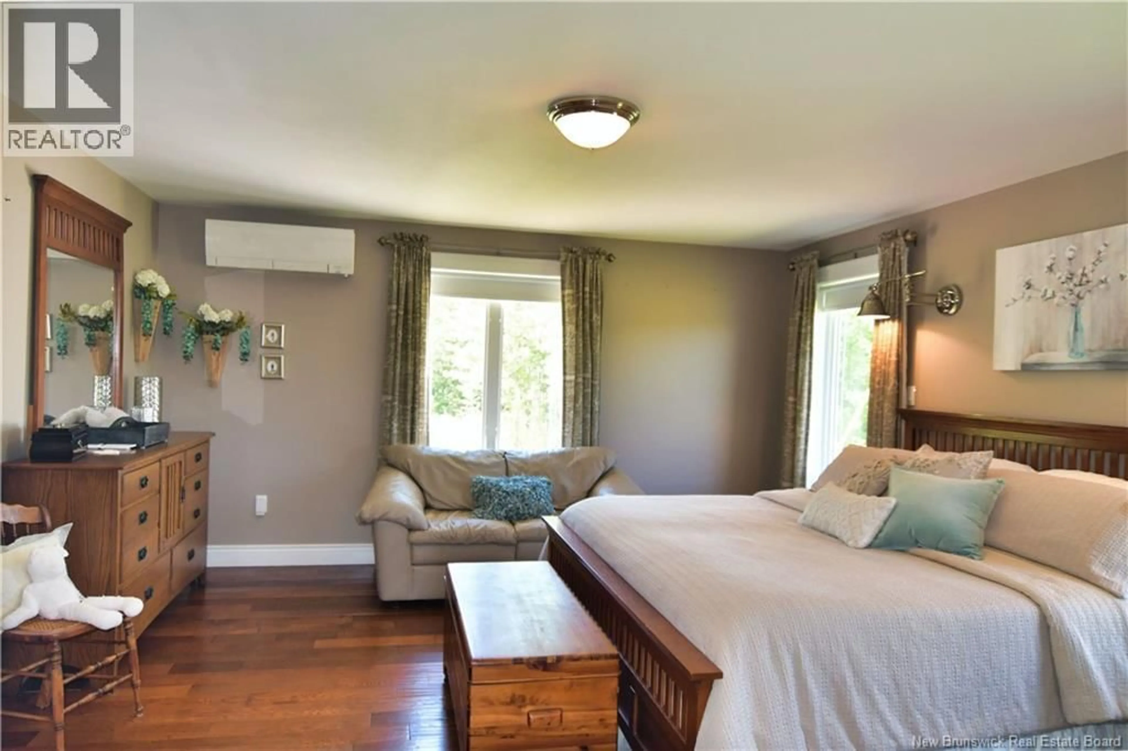 Bedroom with bed, wood/laminate floor for 905 FUNDY DRIVE, Wilsons Beach New Brunswick E5E1Y5