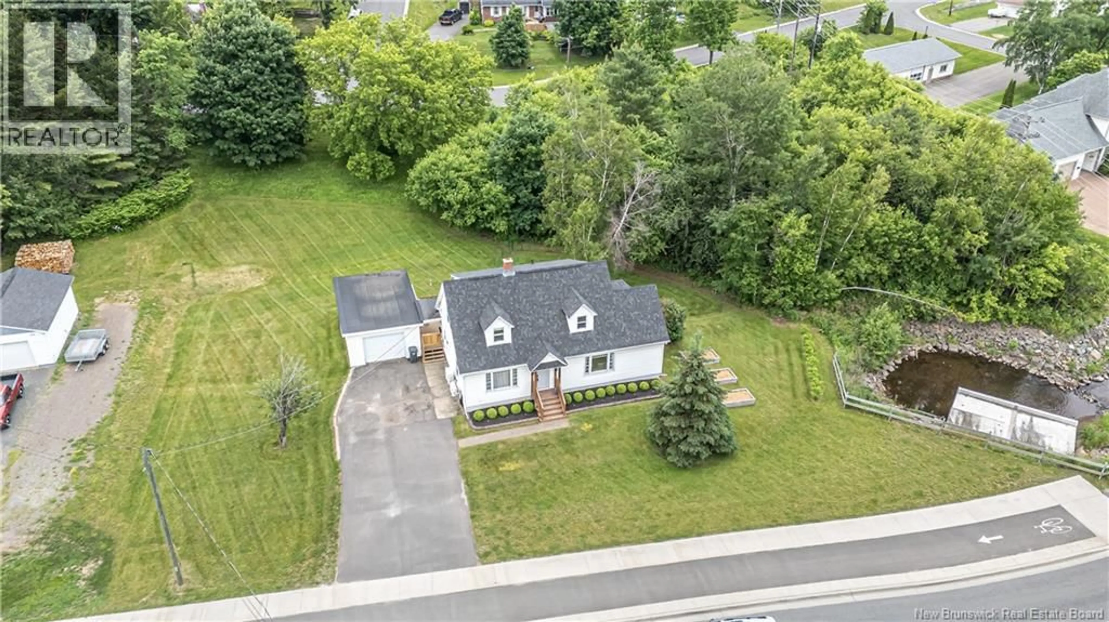 A pic from outside/outdoor area/front of a property/back of a property/a pic from drone, street for 154 BROOKSIDE DRIVE, Fredericton New Brunswick E3A1T6