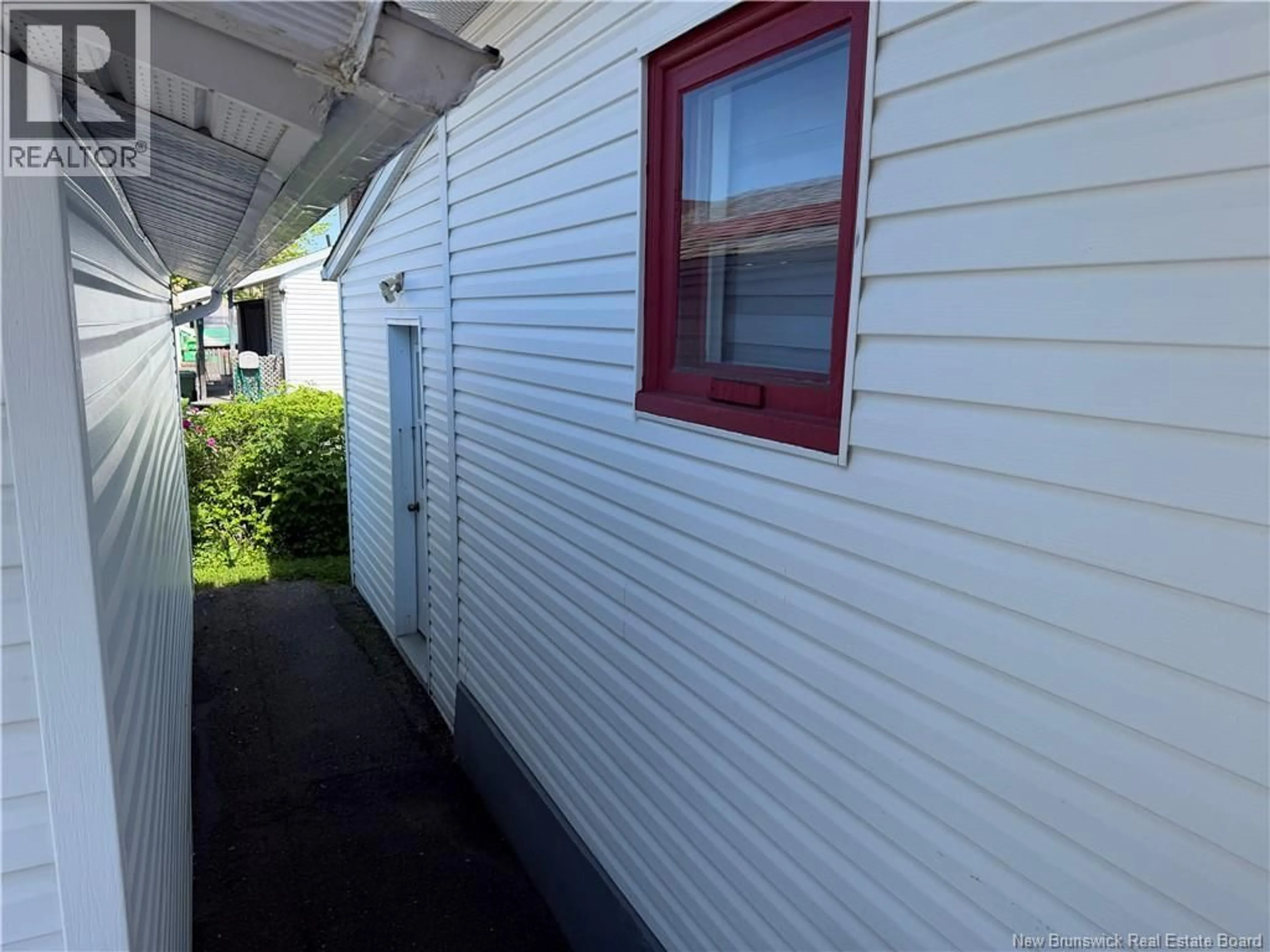Home with vinyl exterior material, street for 18 DUGAL STREET, Edmundston New Brunswick E3V1X5