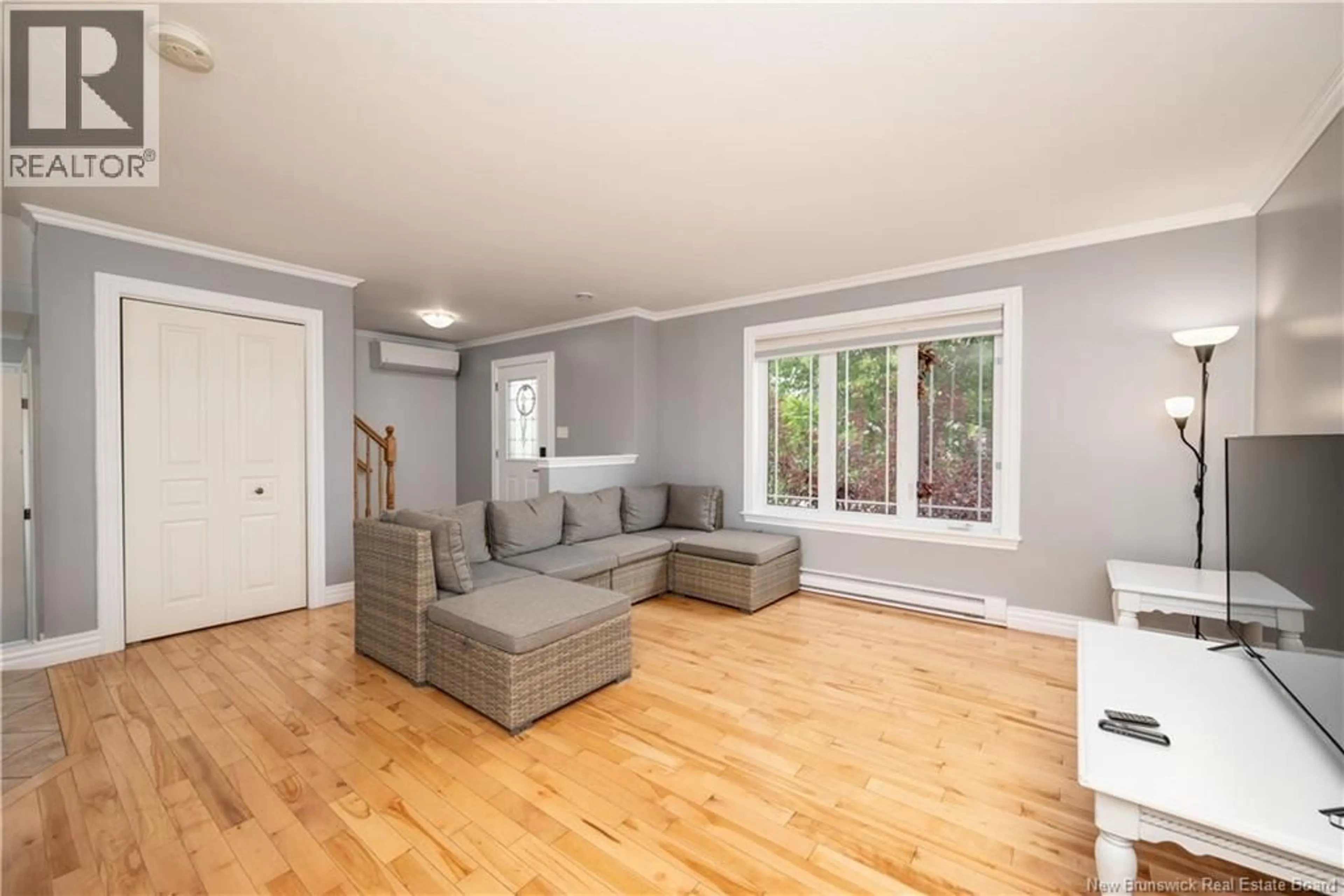 Living room with furniture, wood/laminate floor for 109 GAGNON DRIVE, Moncton New Brunswick E1A0B8