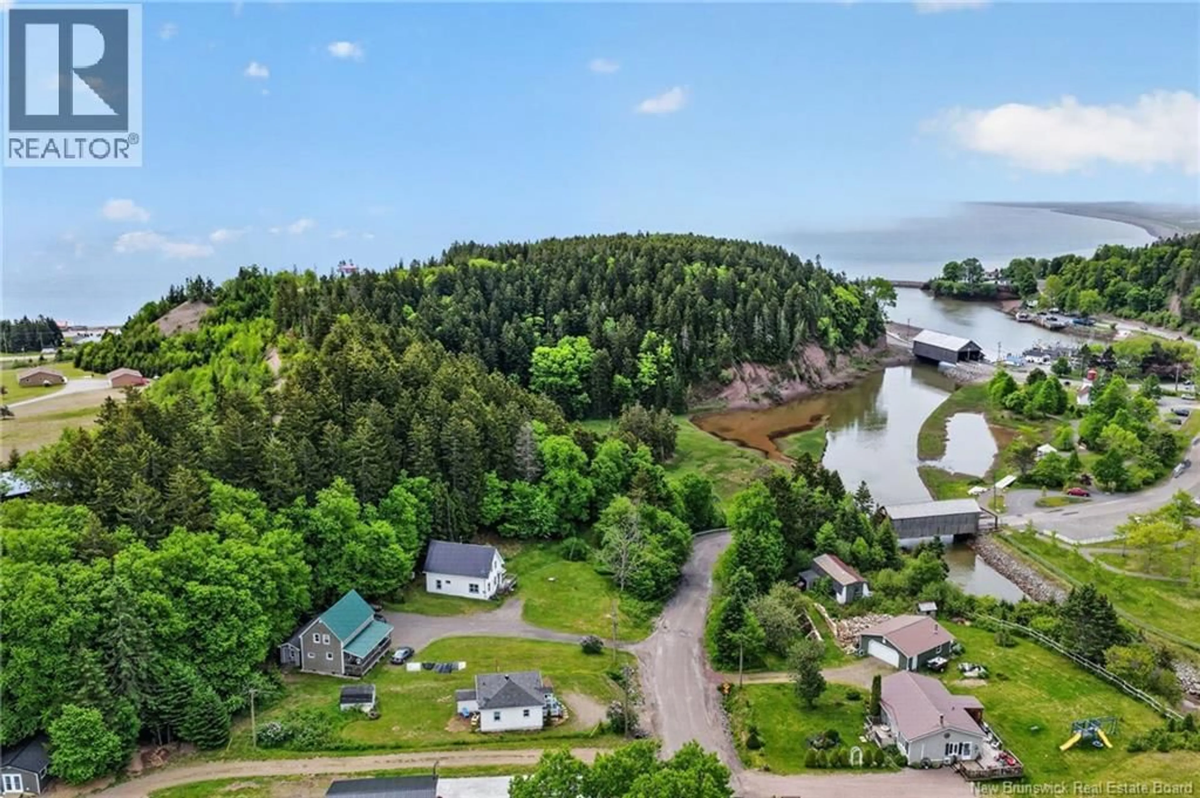 A pic from outside/outdoor area/front of a property/back of a property/a pic from drone, water/lake/river/ocean view for 18 VAUGHAN CREEK ROAD, Orange Hill New Brunswick E5R1H2