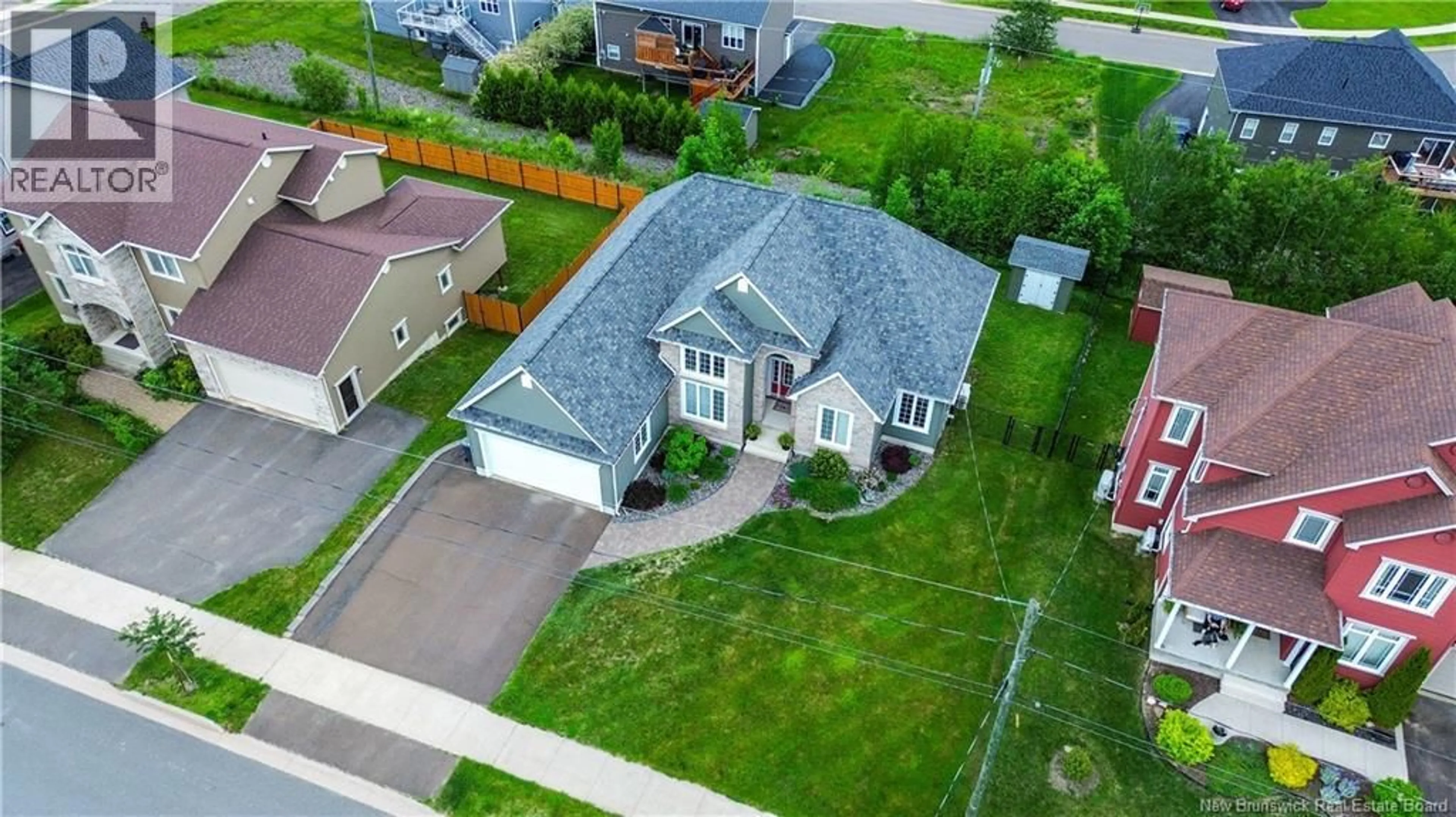 A pic from outside/outdoor area/front of a property/back of a property/a pic from drone, street for 142 SPRUCEWOOD DRIVE, New Maryland New Brunswick E3C1C5