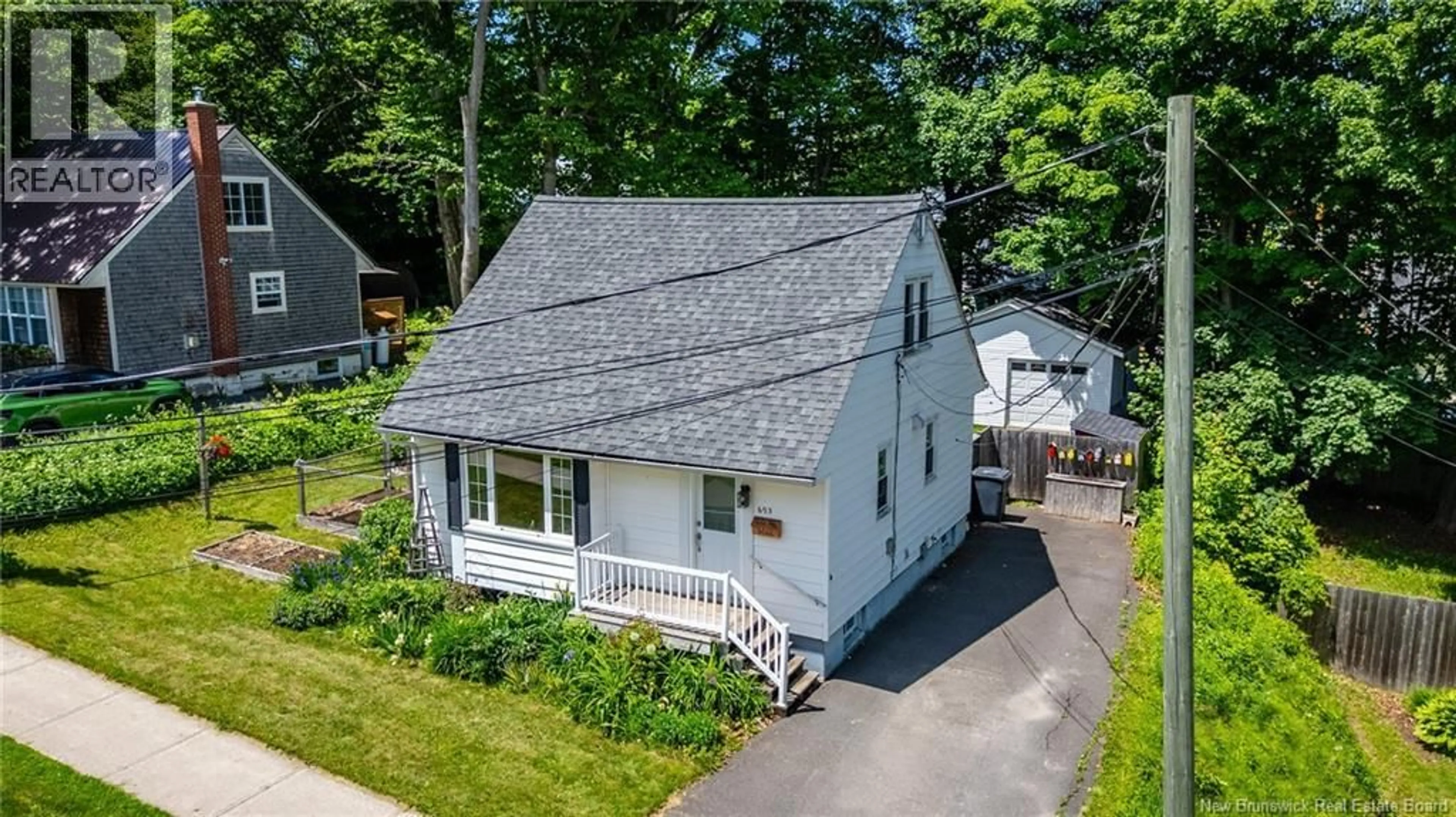 A pic from outside/outdoor area/front of a property/back of a property/a pic from drone, street for 695 REID STREET, Fredericton New Brunswick E3B3V6
