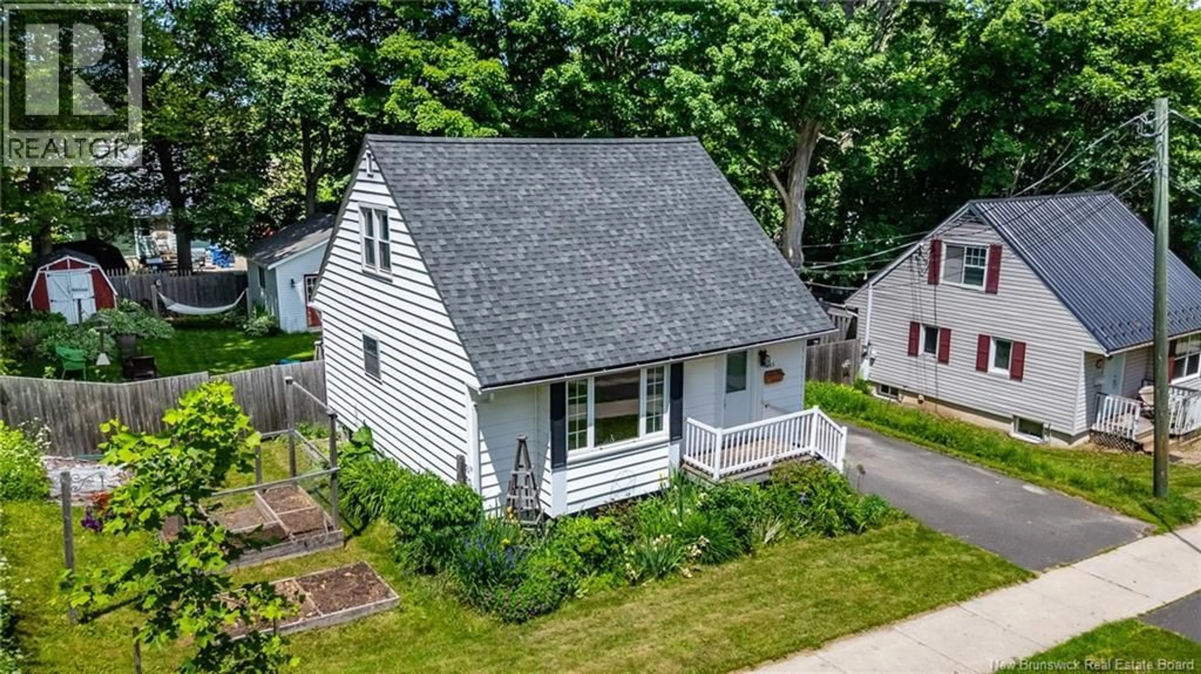 A pic from outside/outdoor area/front of a property/back of a property/a pic from drone, street for 695 REID STREET, Fredericton New Brunswick E3B3V6