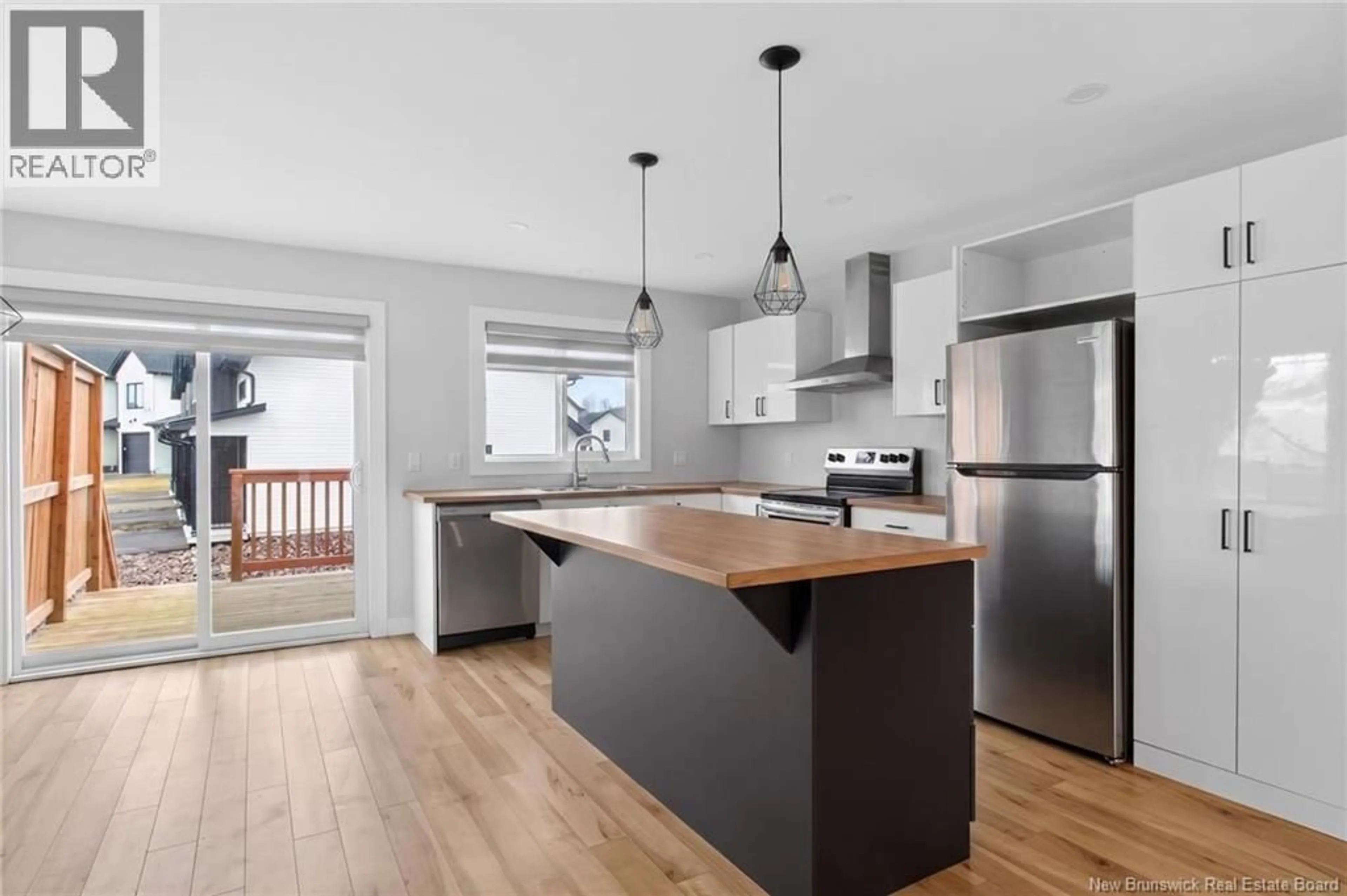 Open concept kitchen, wood/laminate floor for 97 NORBERT, Dieppe New Brunswick E1A8R4