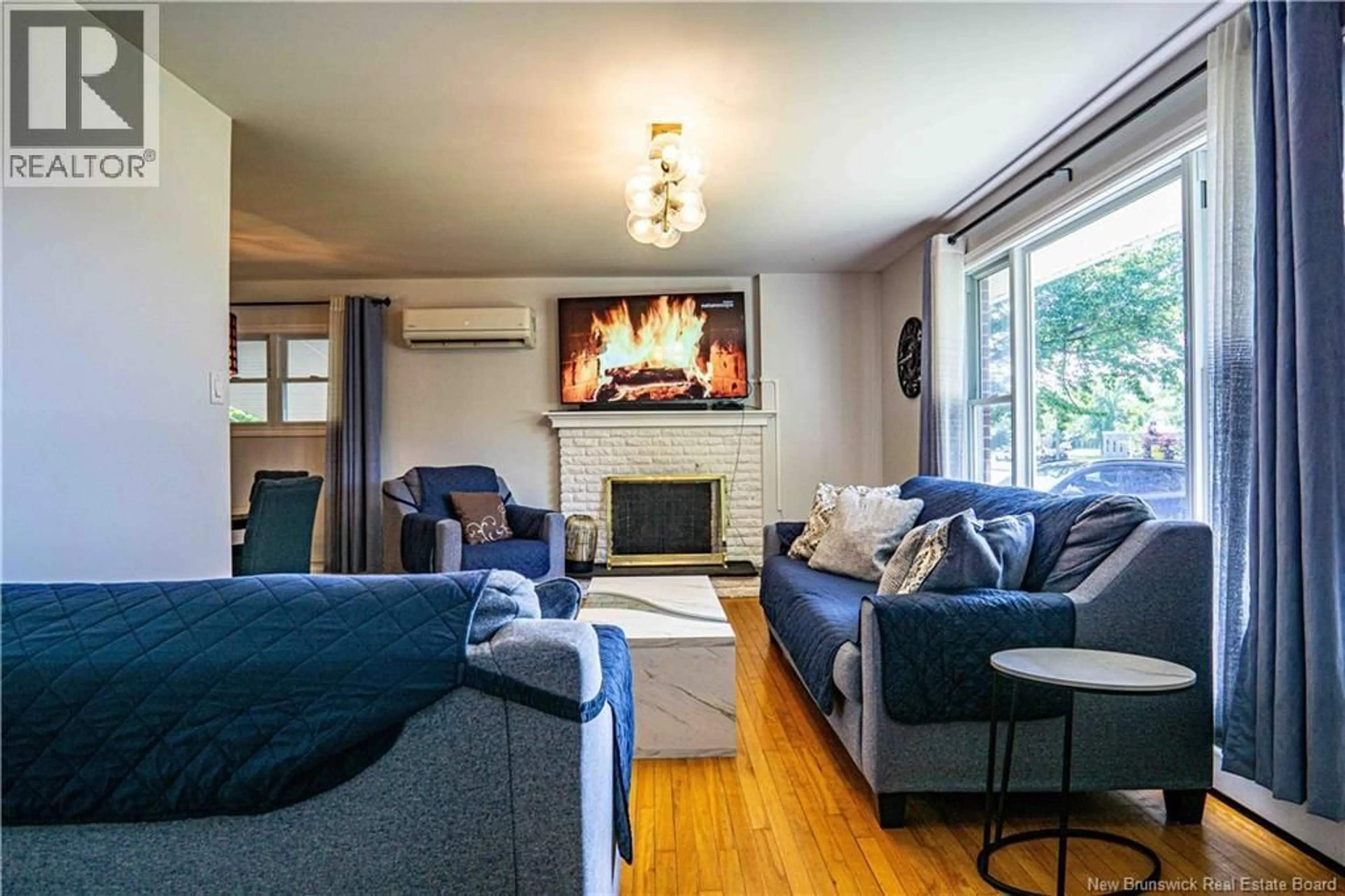 Living room with furniture, wood/laminate floor for 65 LIVERPOOL STREET, Fredericton New Brunswick E3B4V3