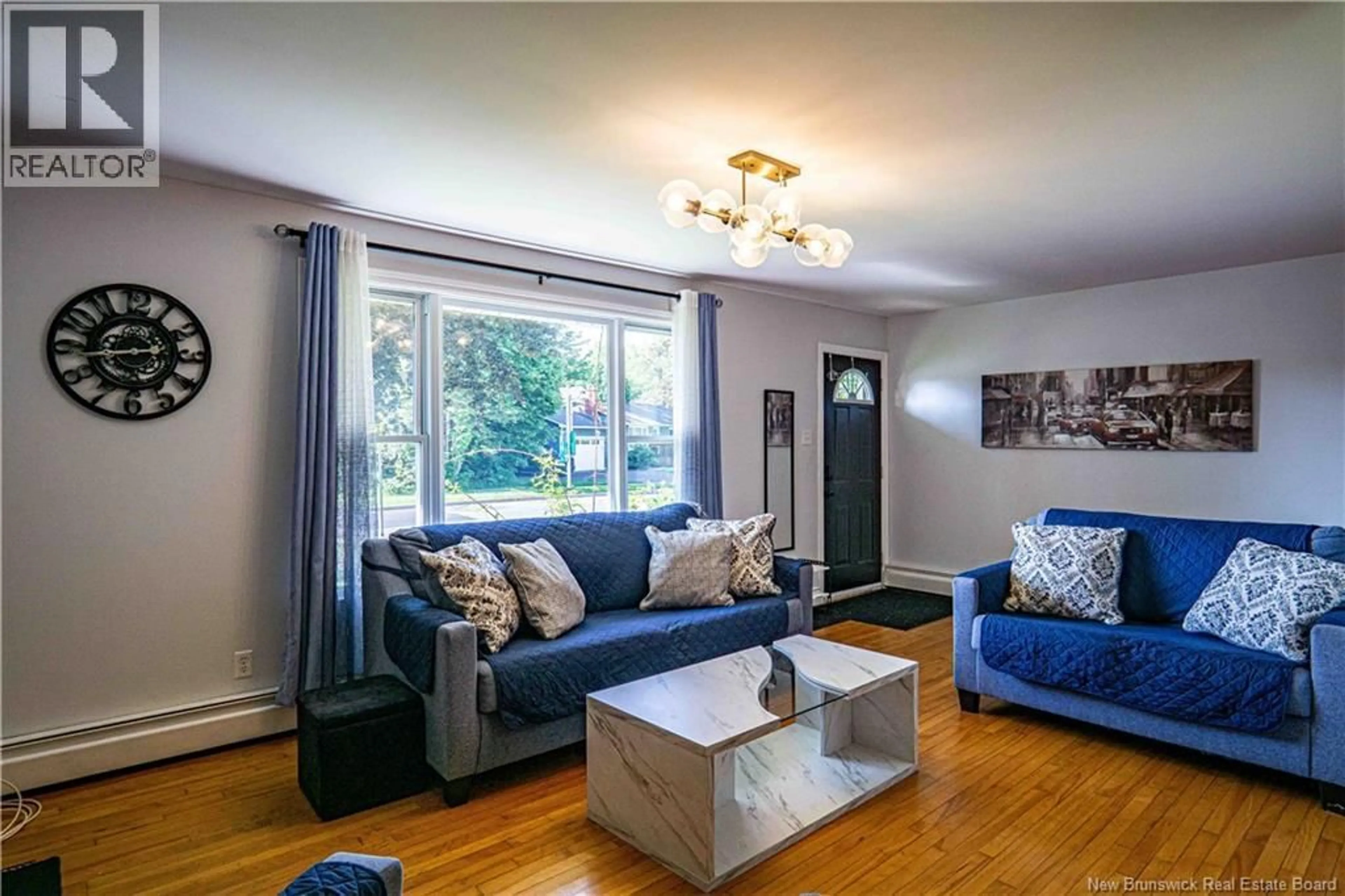 Living room with furniture, wood/laminate floor for 65 LIVERPOOL STREET, Fredericton New Brunswick E3B4V3