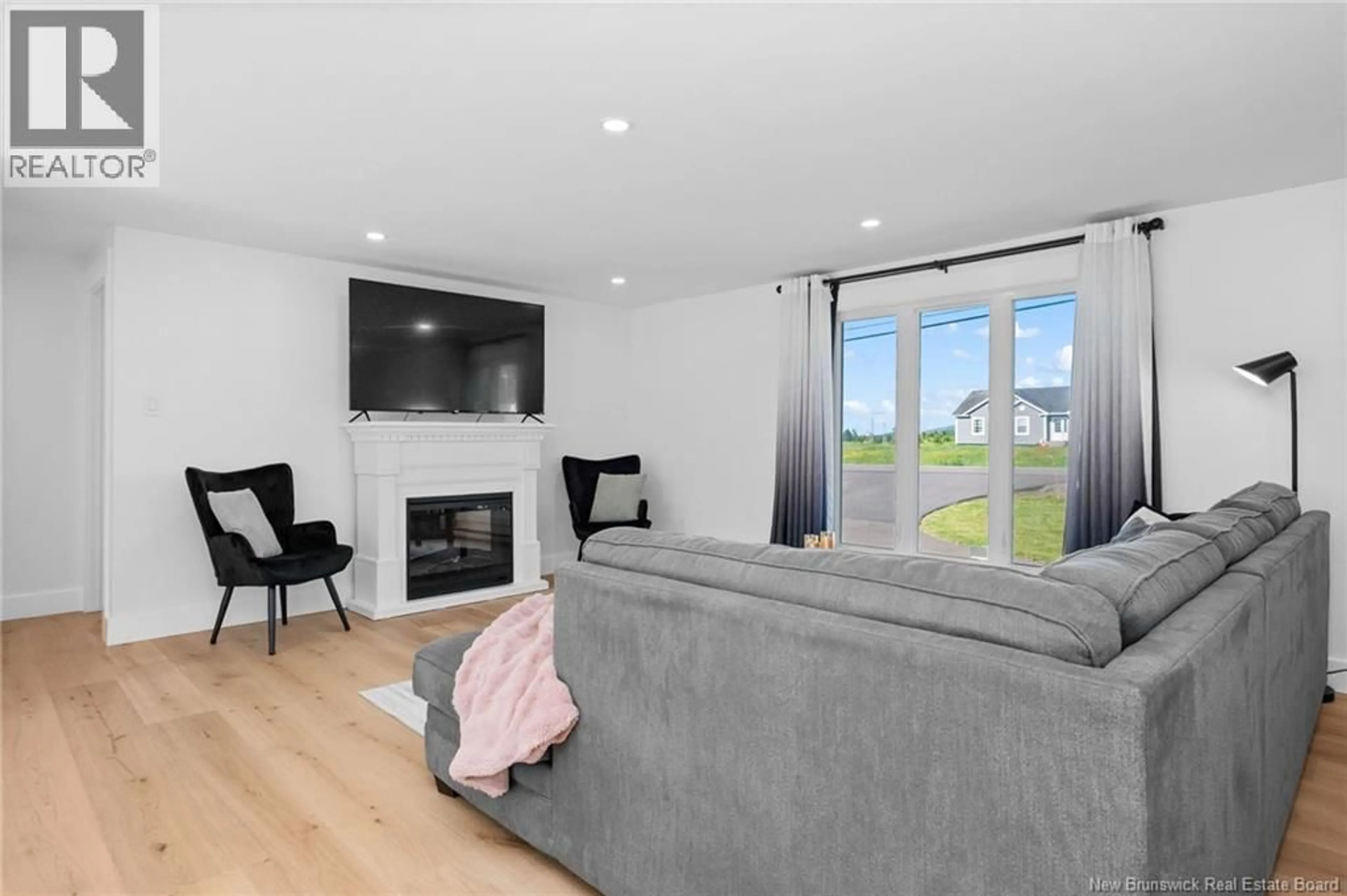 Living room with furniture, wood/laminate floor for 2287 ROUTE 490, Ammon New Brunswick E1G3P3