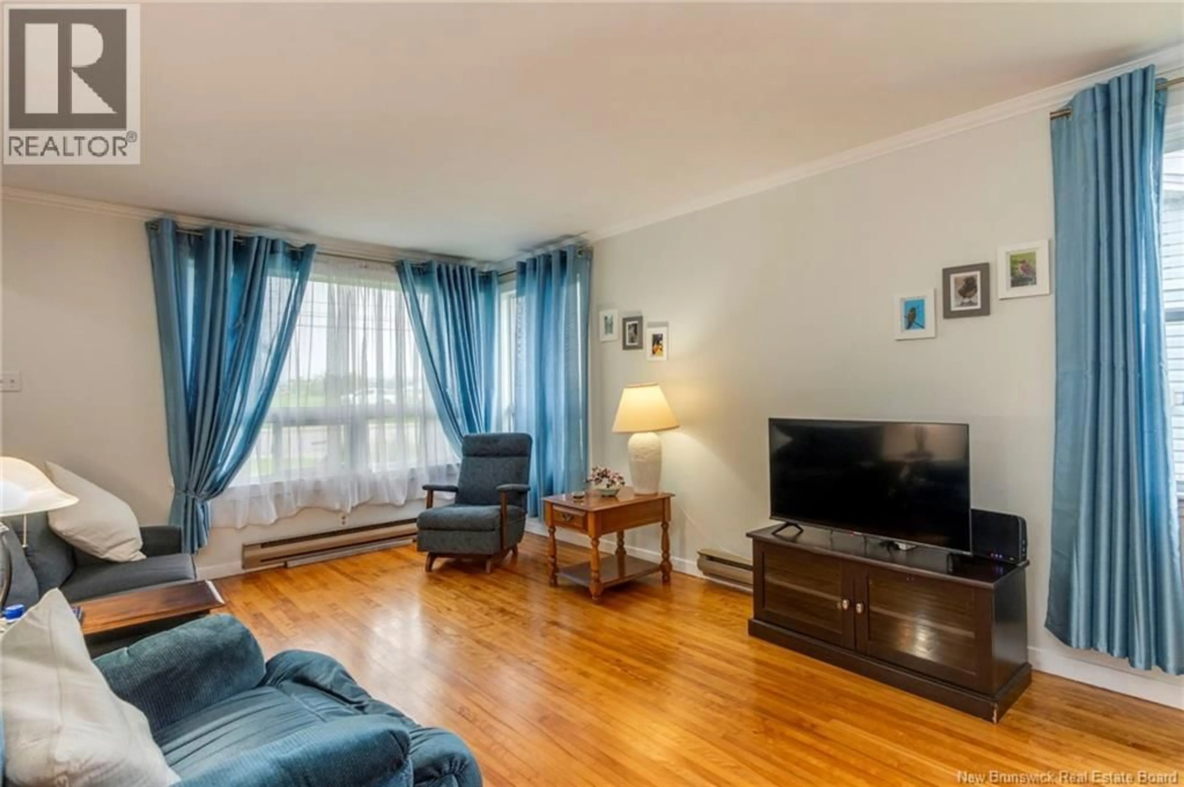 Living room with furniture, wood/laminate floor for 97 GOLDEN GROVE ROAD, Saint John New Brunswick E2H1W6